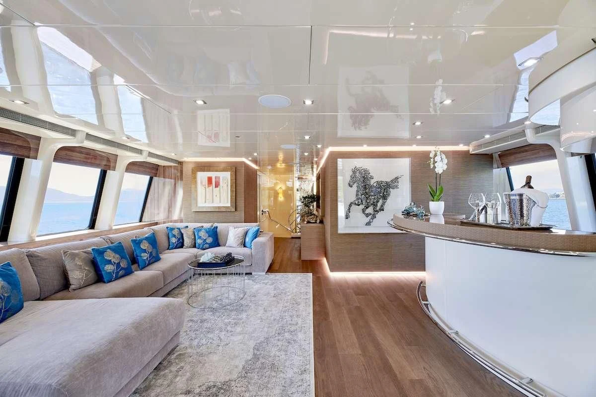 a large living room with a large open window aboard PROMETHEUS I Yacht for Charter