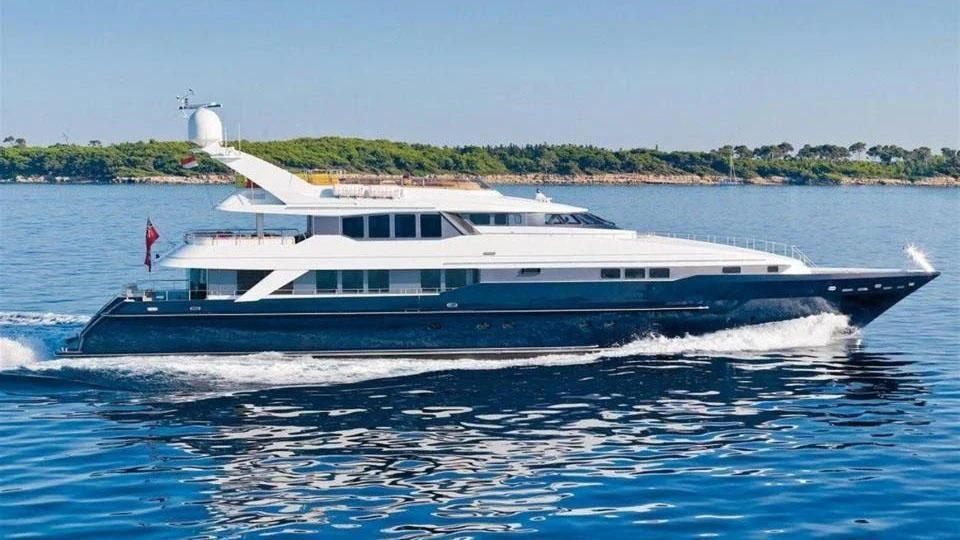 a large white boat on the water aboard PROMETHEUS I Yacht for Charter