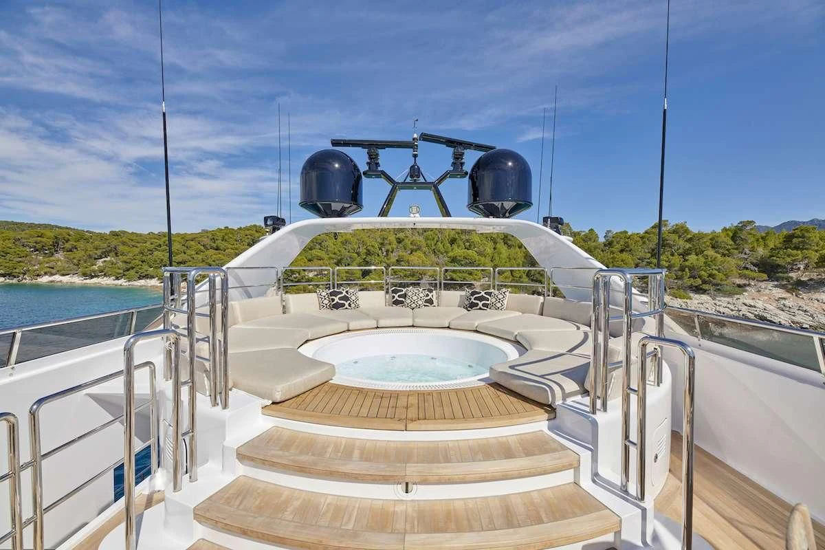 a large white boat with a large round black object on it aboard PROMETHEUS I Yacht for Charter