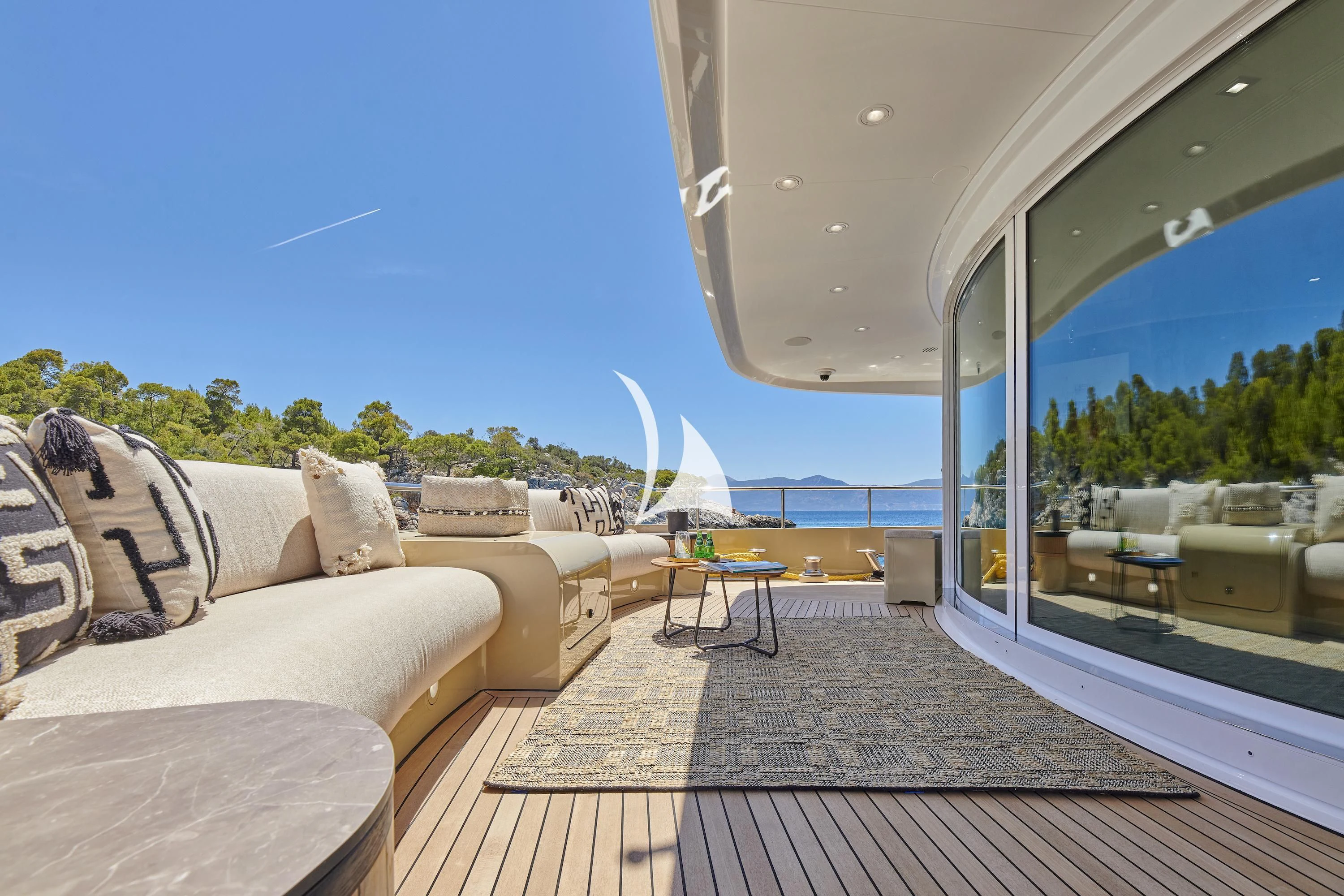 a living room with a large window aboard PROMETHEUS I Yacht for Charter
