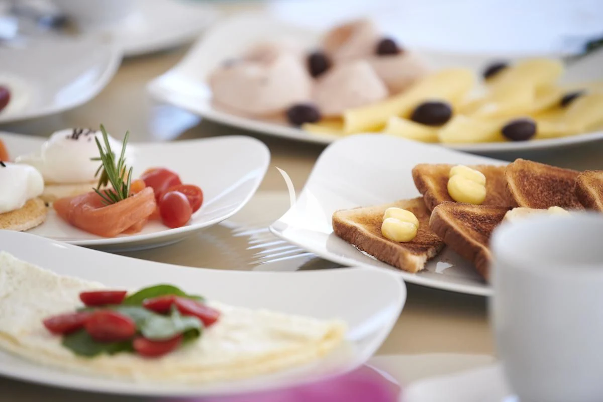 a table with plates of food aboard PROMETHEUS I Yacht for Charter