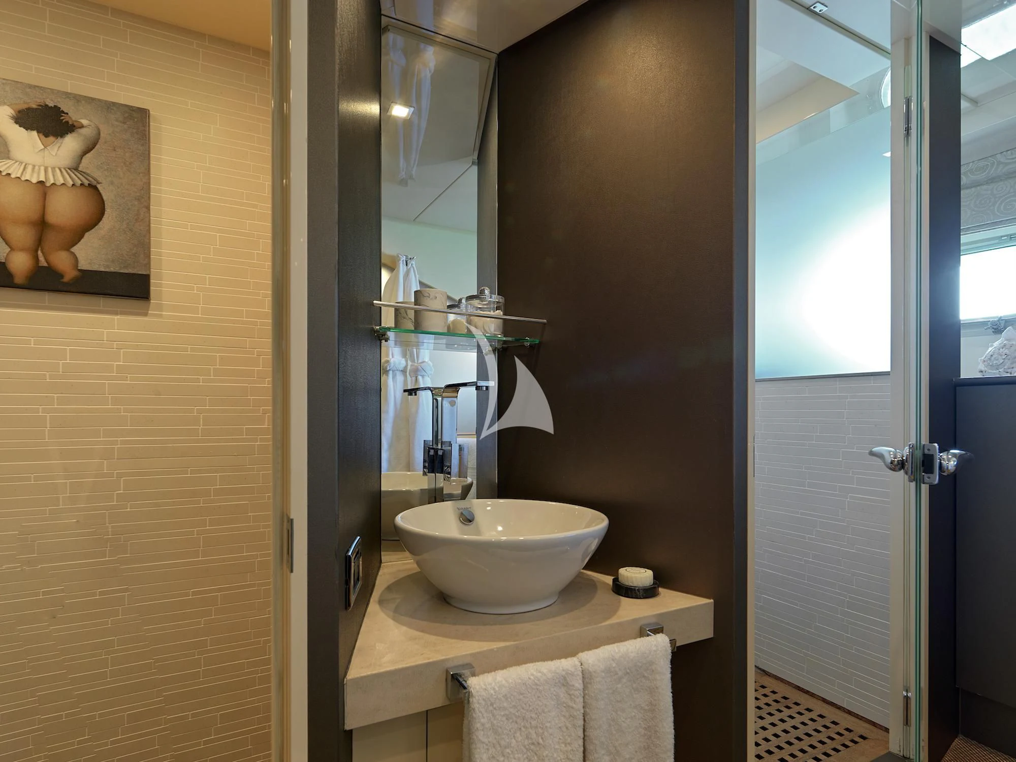 a bathroom with a sink and a mirror aboard PROMETHEUS I Yacht for Charter