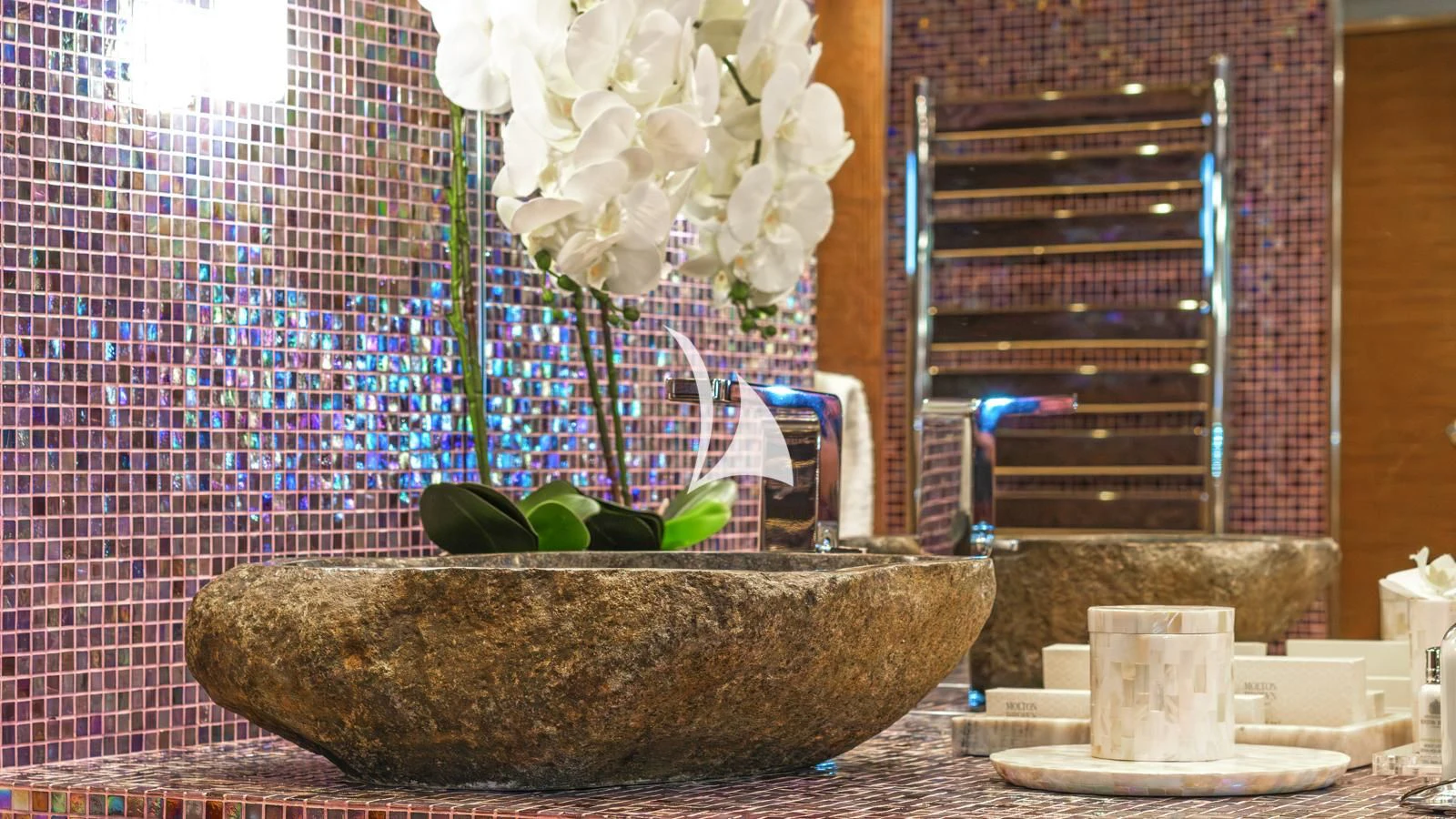 a large indoor planter with white flowers aboard PROMETHEUS I Yacht for Charter