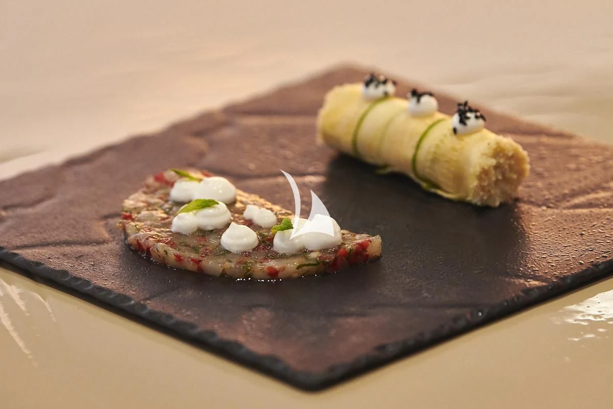 a banana and a cookie on a table aboard PROMETHEUS I Yacht for Charter