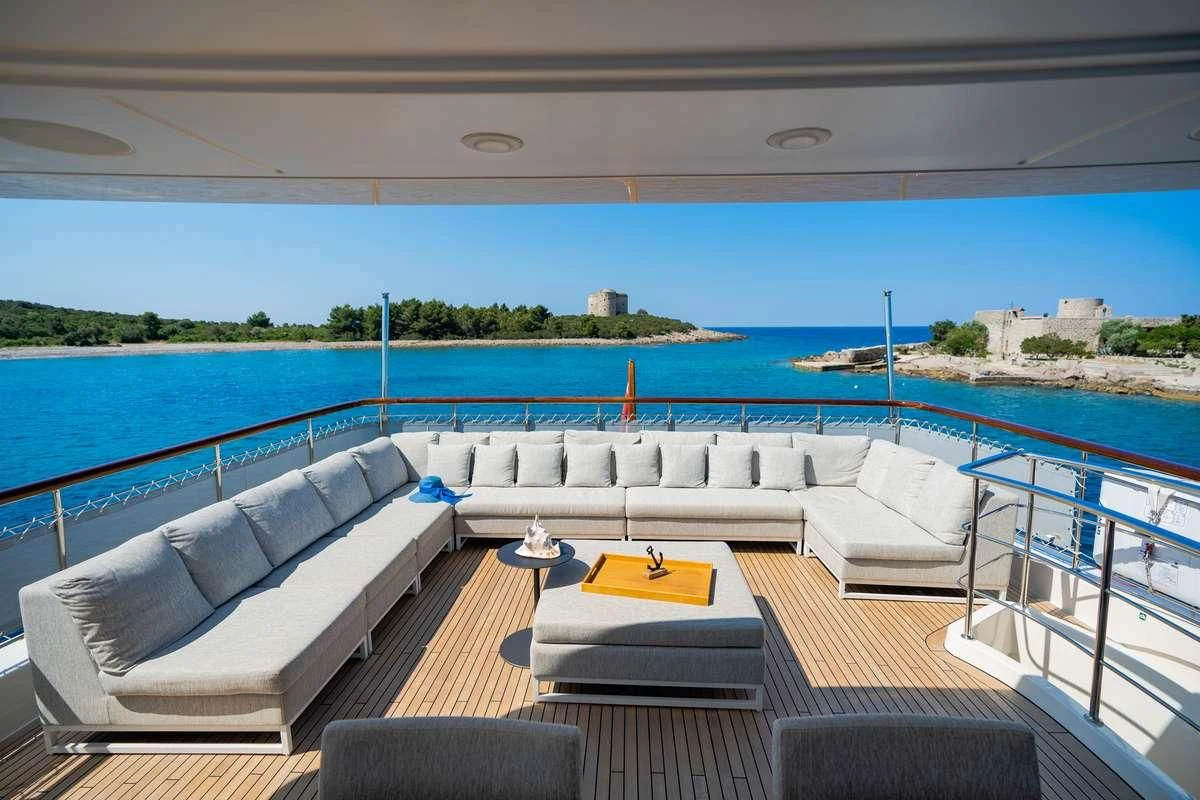 a large pool with couches aboard VALENTINA II Yacht for Sale