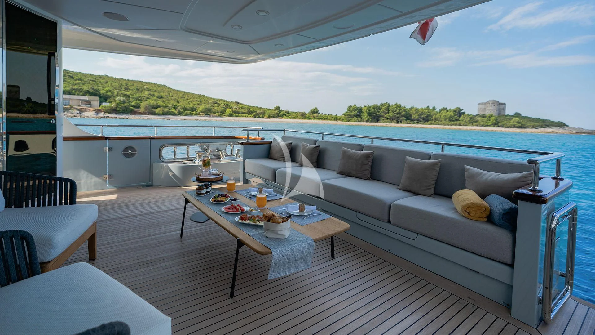 a couch and a table on a boat aboard VALENTINA II Yacht for Sale