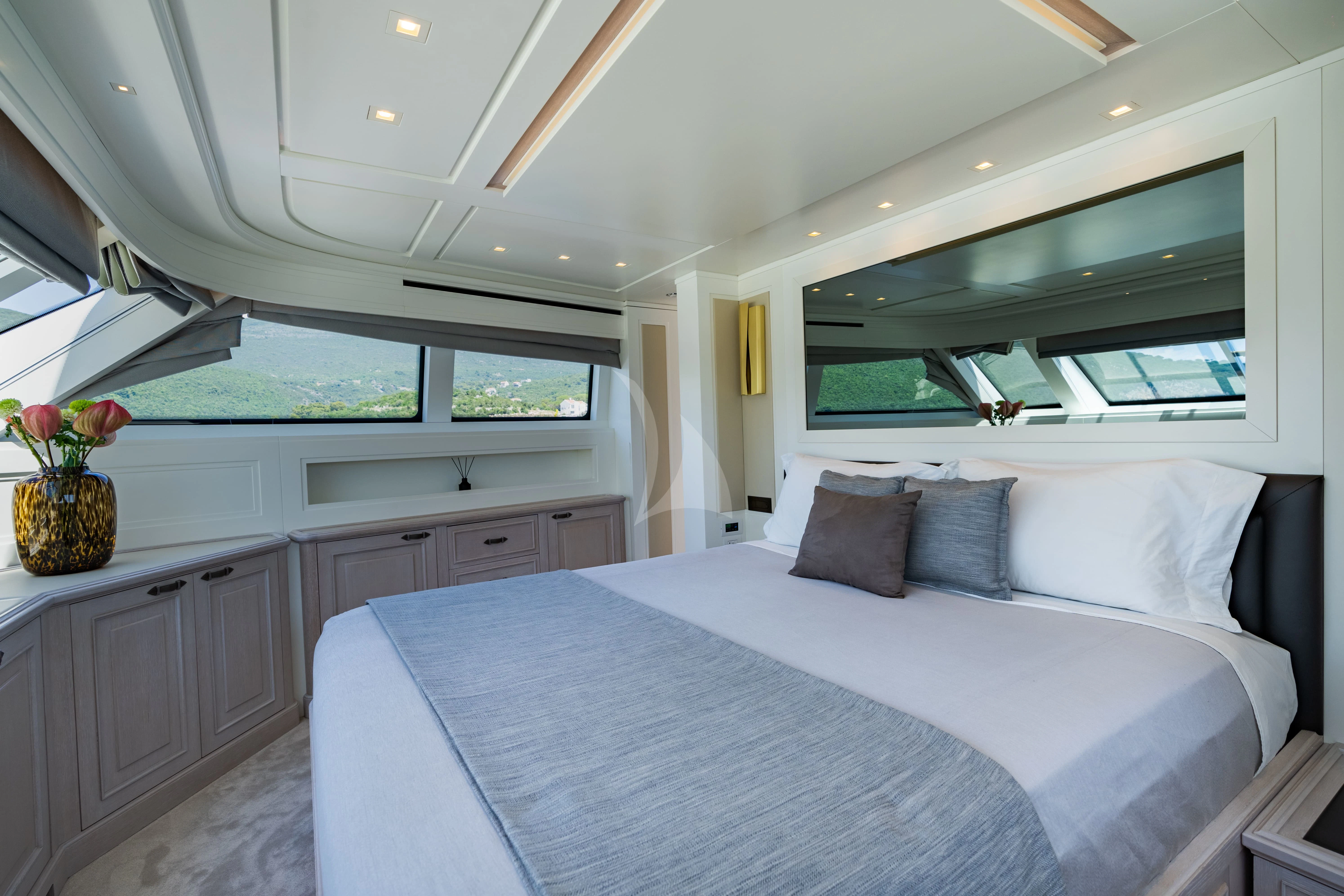 a large bed in a room aboard VALENTINA II Yacht for Sale