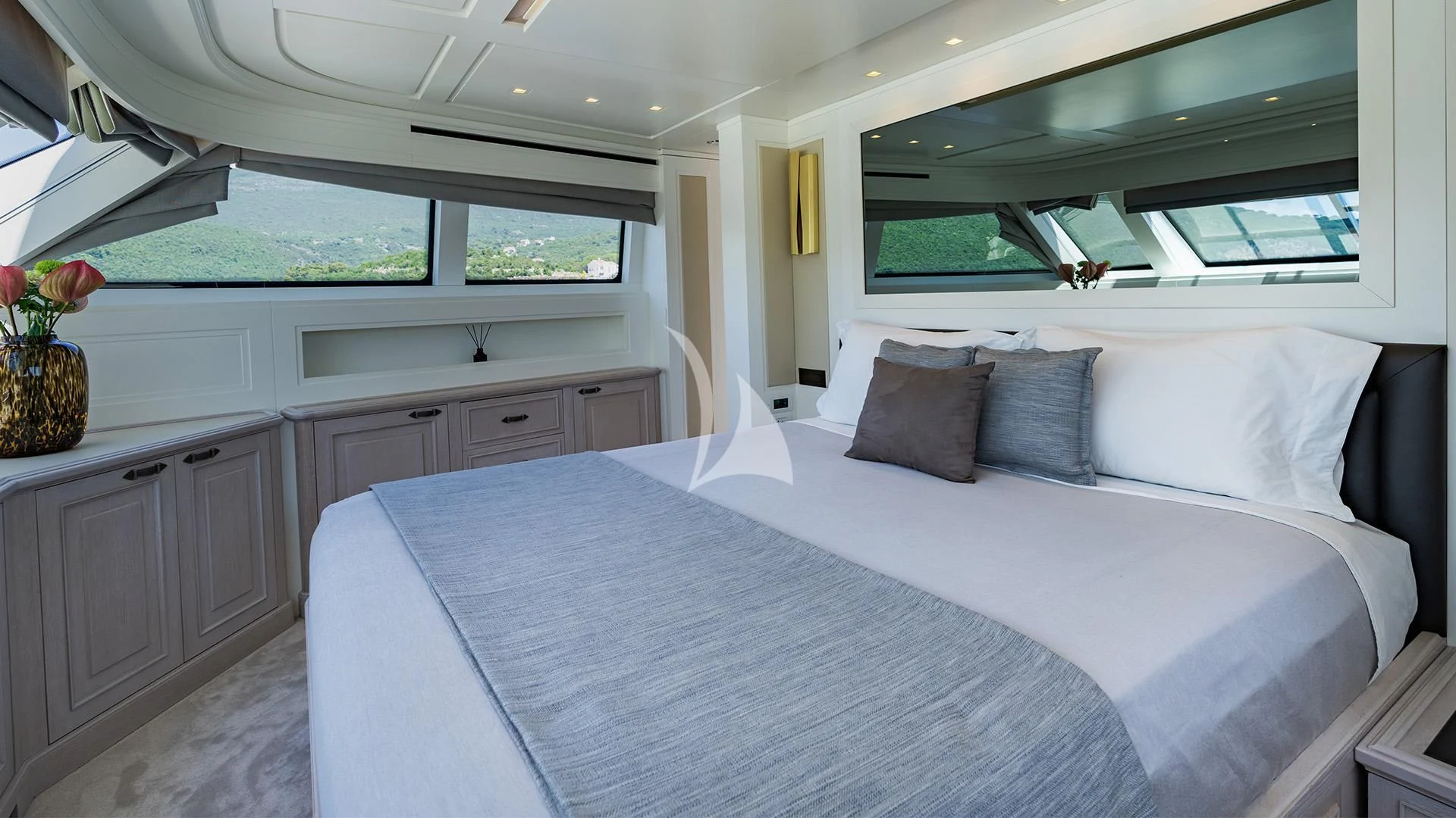 a bed with white sheets and pillows aboard VALENTINA II Yacht for Sale