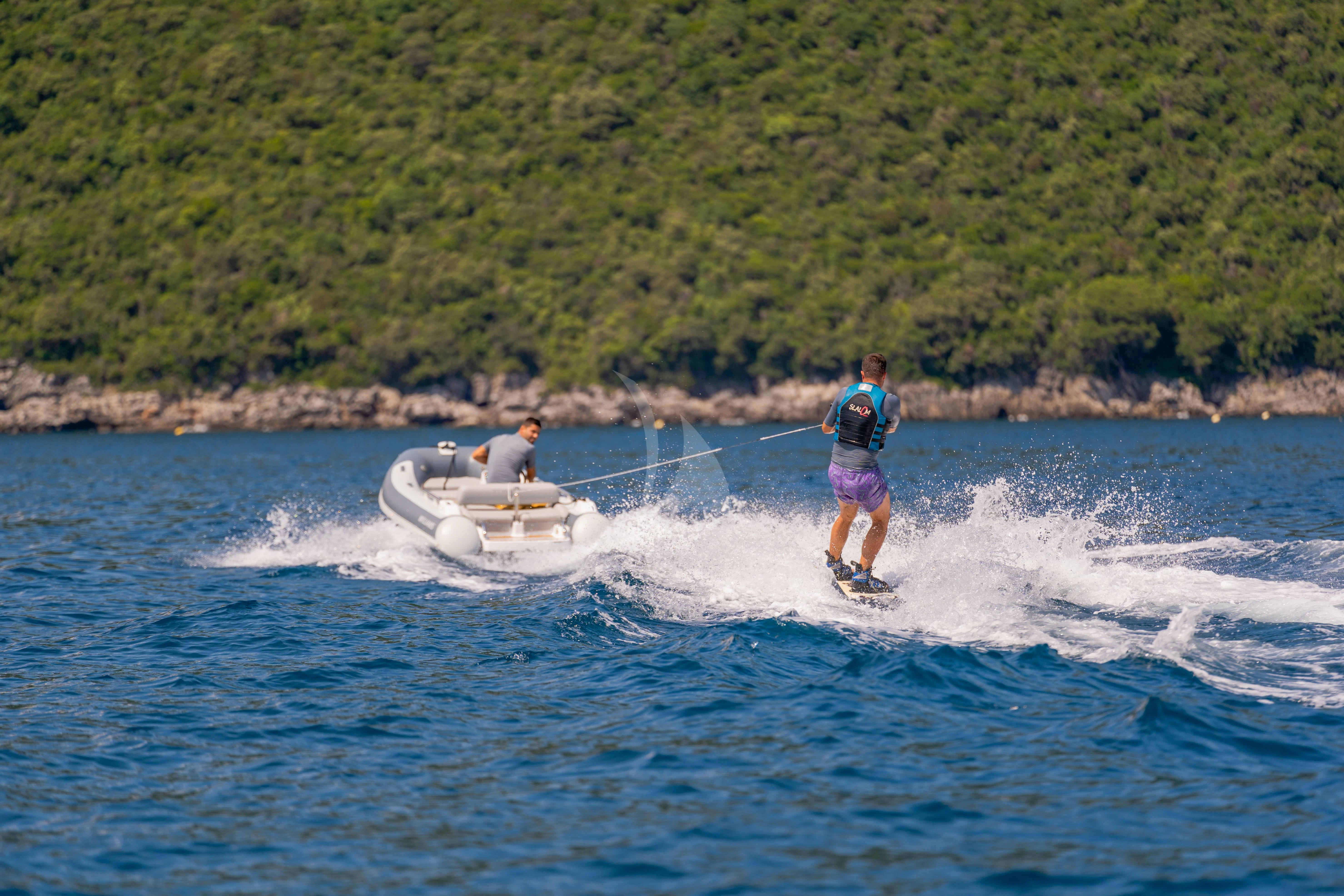 a couple of people on jet skis in the water aboard VALENTINA II Yacht for Sale