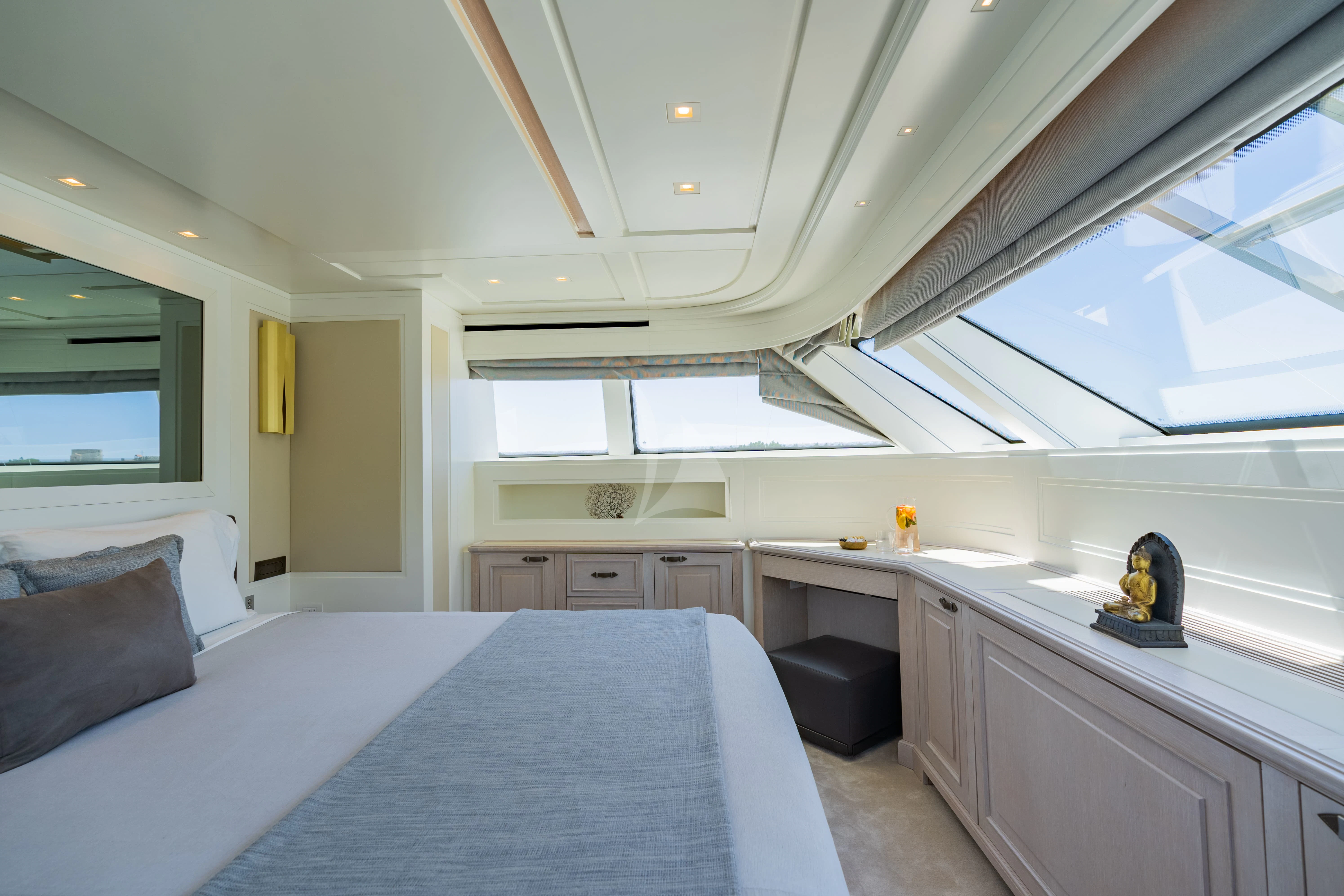 a bedroom with a bed and a desk aboard VALENTINA II Yacht for Sale