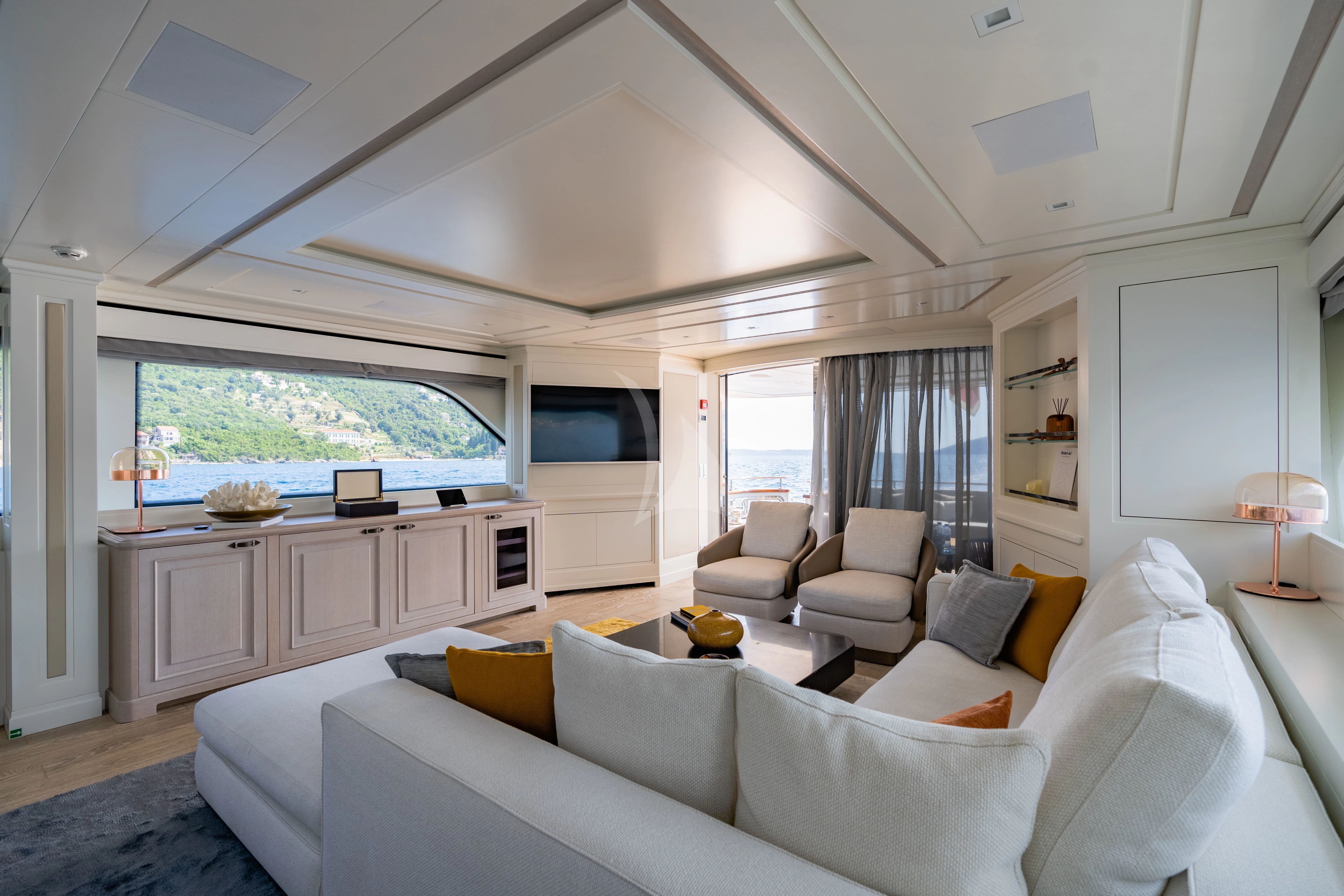 a living room with a large window aboard VALENTINA II Yacht for Sale
