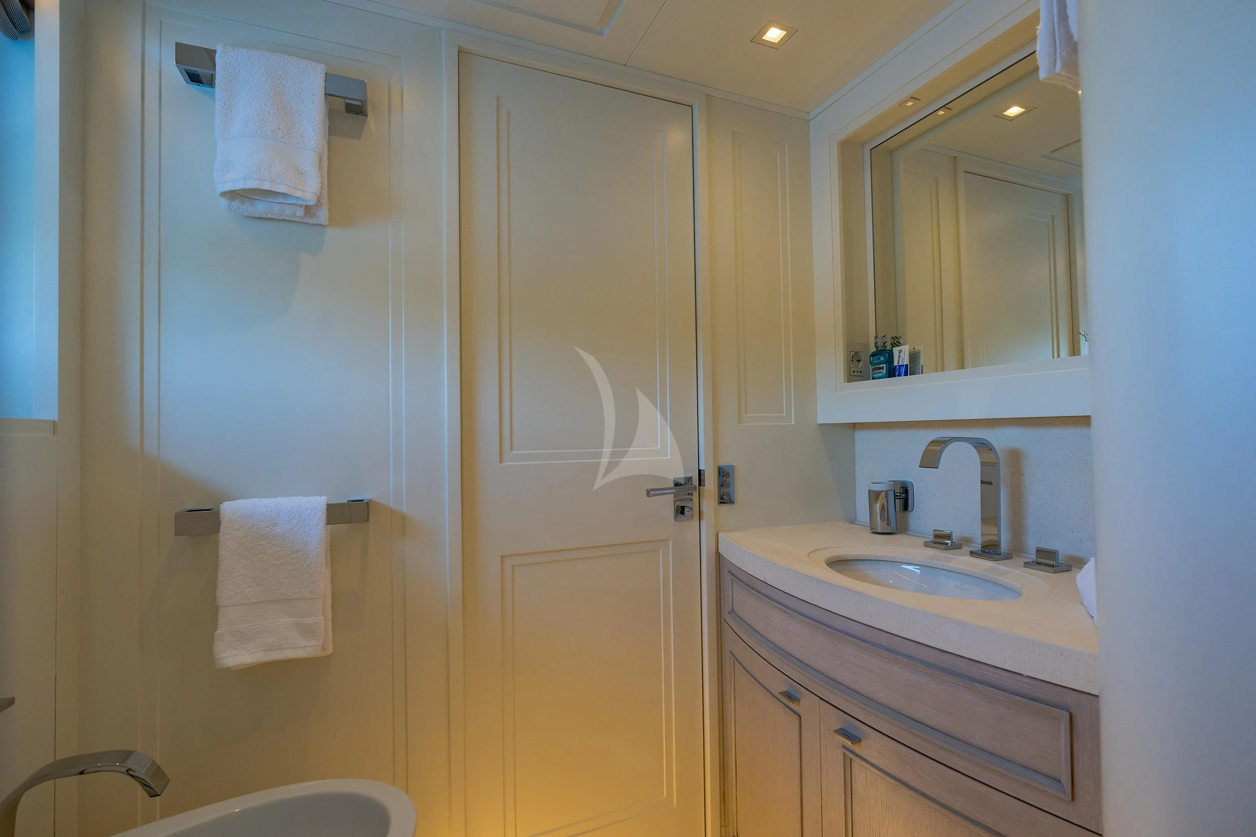 a bathroom with a sink and a mirror aboard VALENTINA II Yacht for Sale