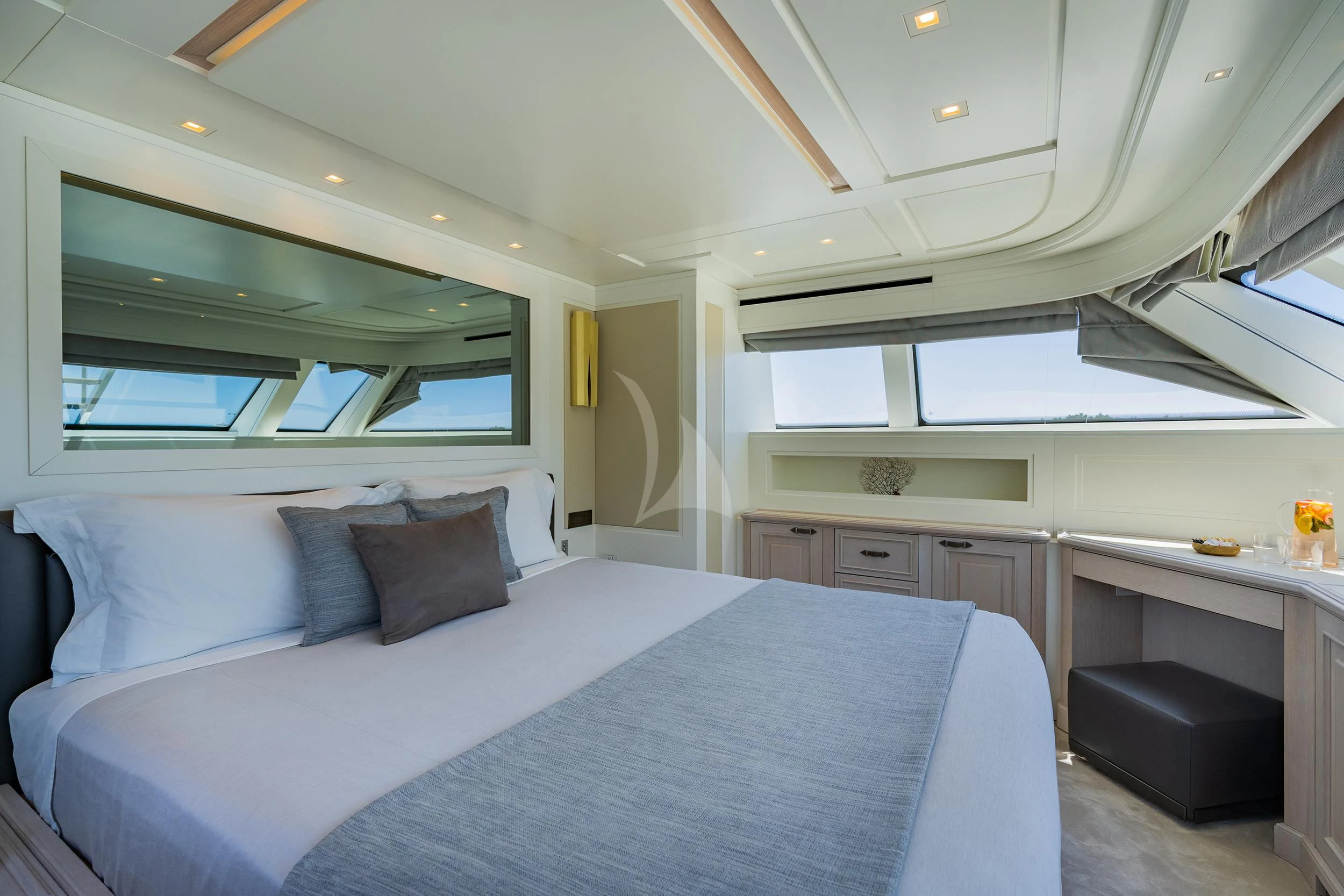 a large bedroom with a large bed aboard VALENTINA II Yacht for Sale