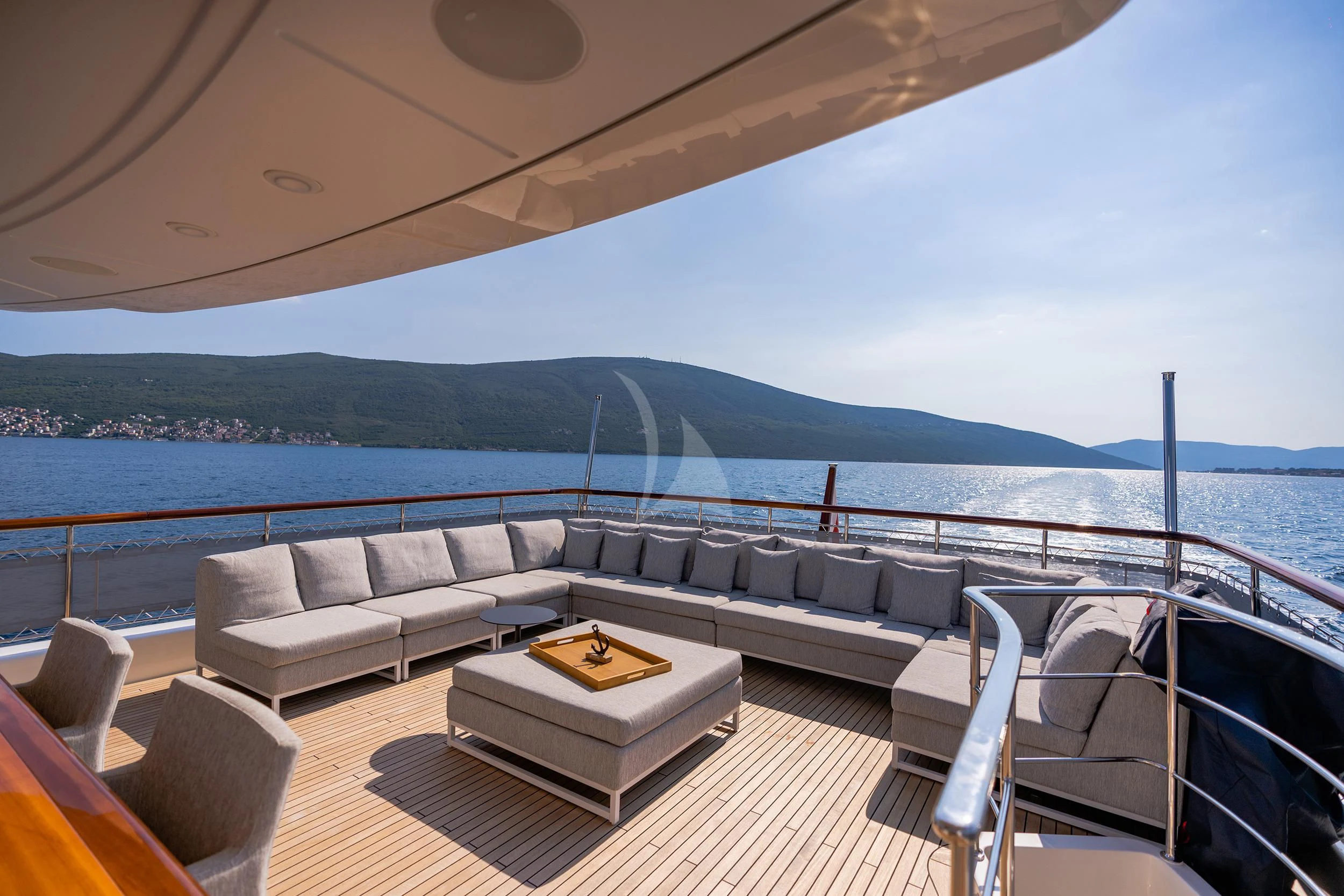 a couch and a table on a boat aboard VALENTINA II Yacht for Sale