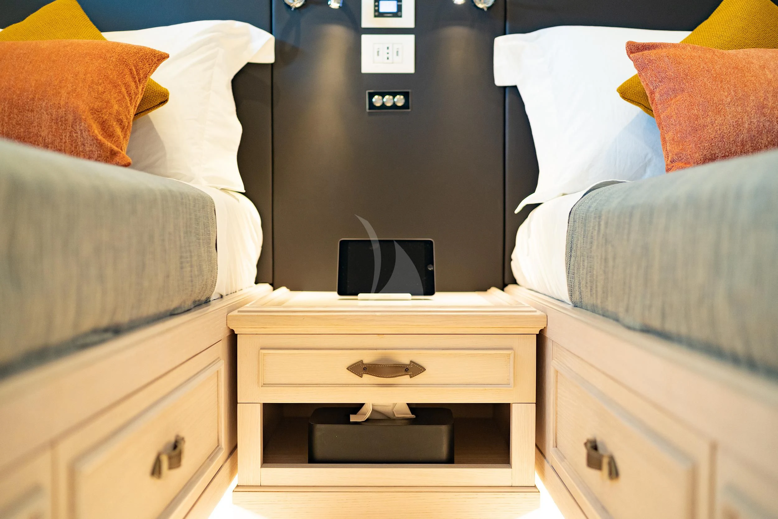 a bed with a television and a bed in the background aboard VALENTINA II Yacht for Sale