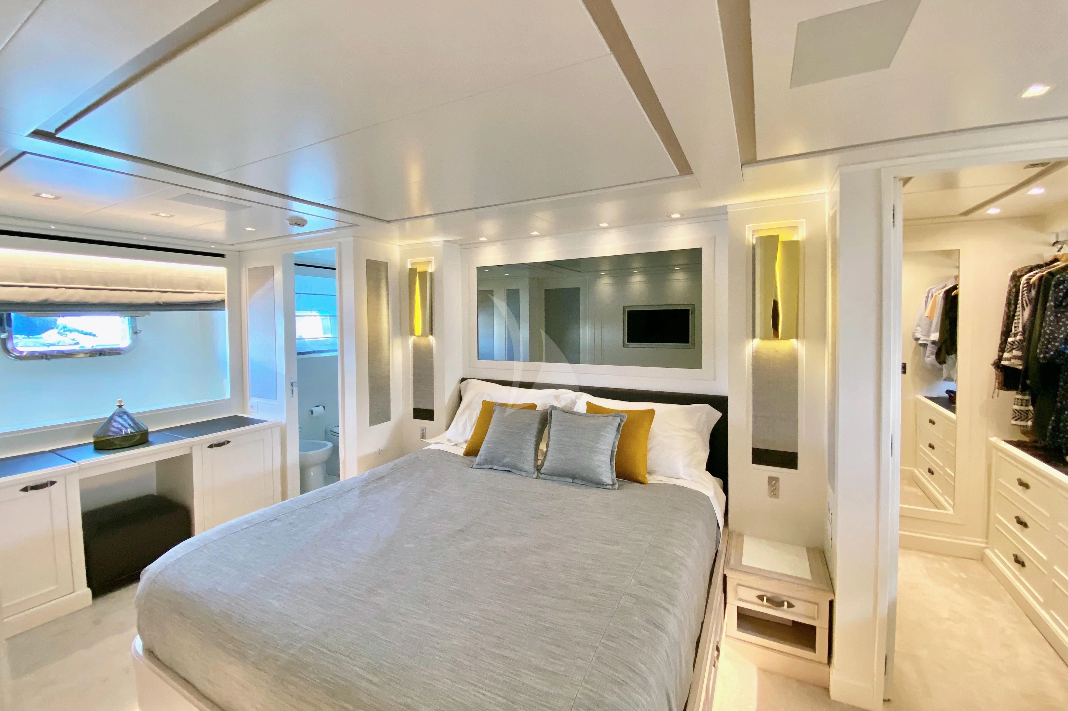 a bedroom with a large bed aboard VALENTINA II Yacht for Sale