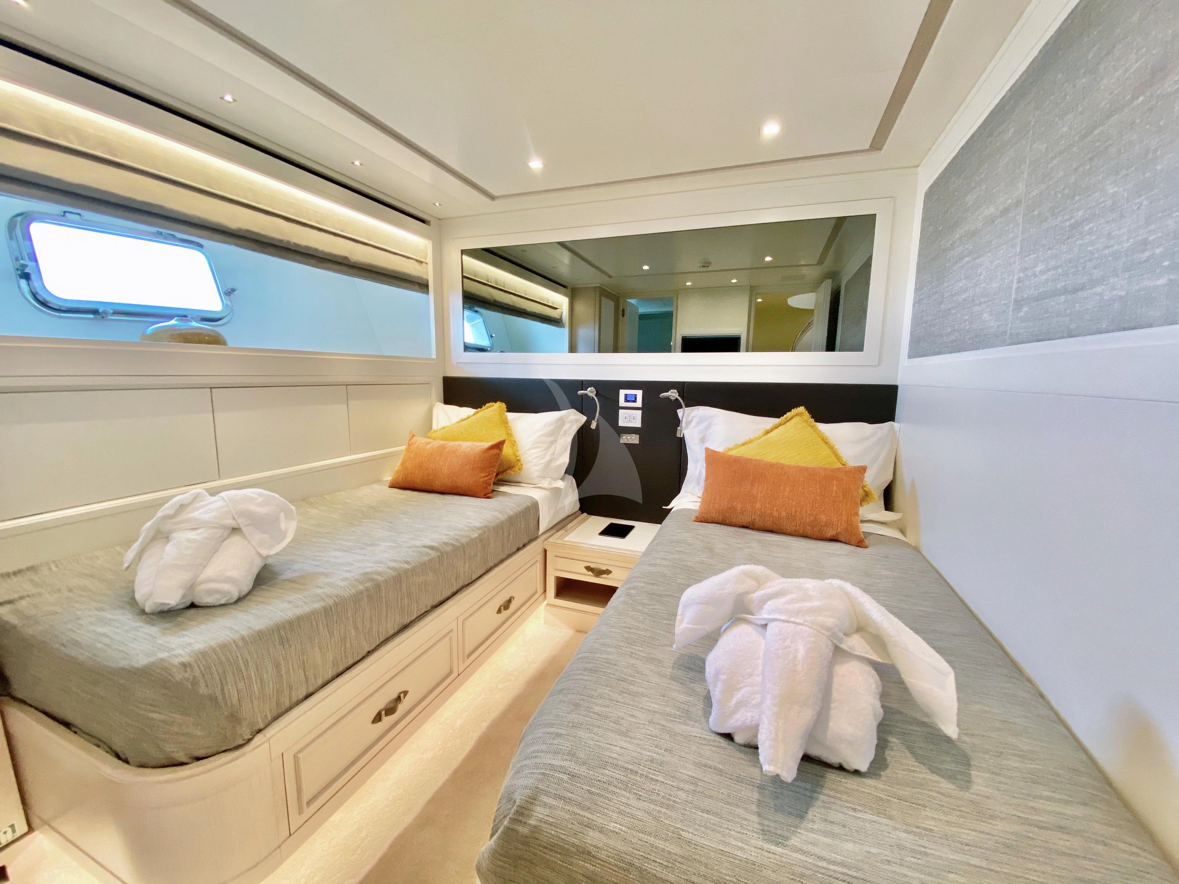 a room with two beds aboard VALENTINA II Yacht for Sale