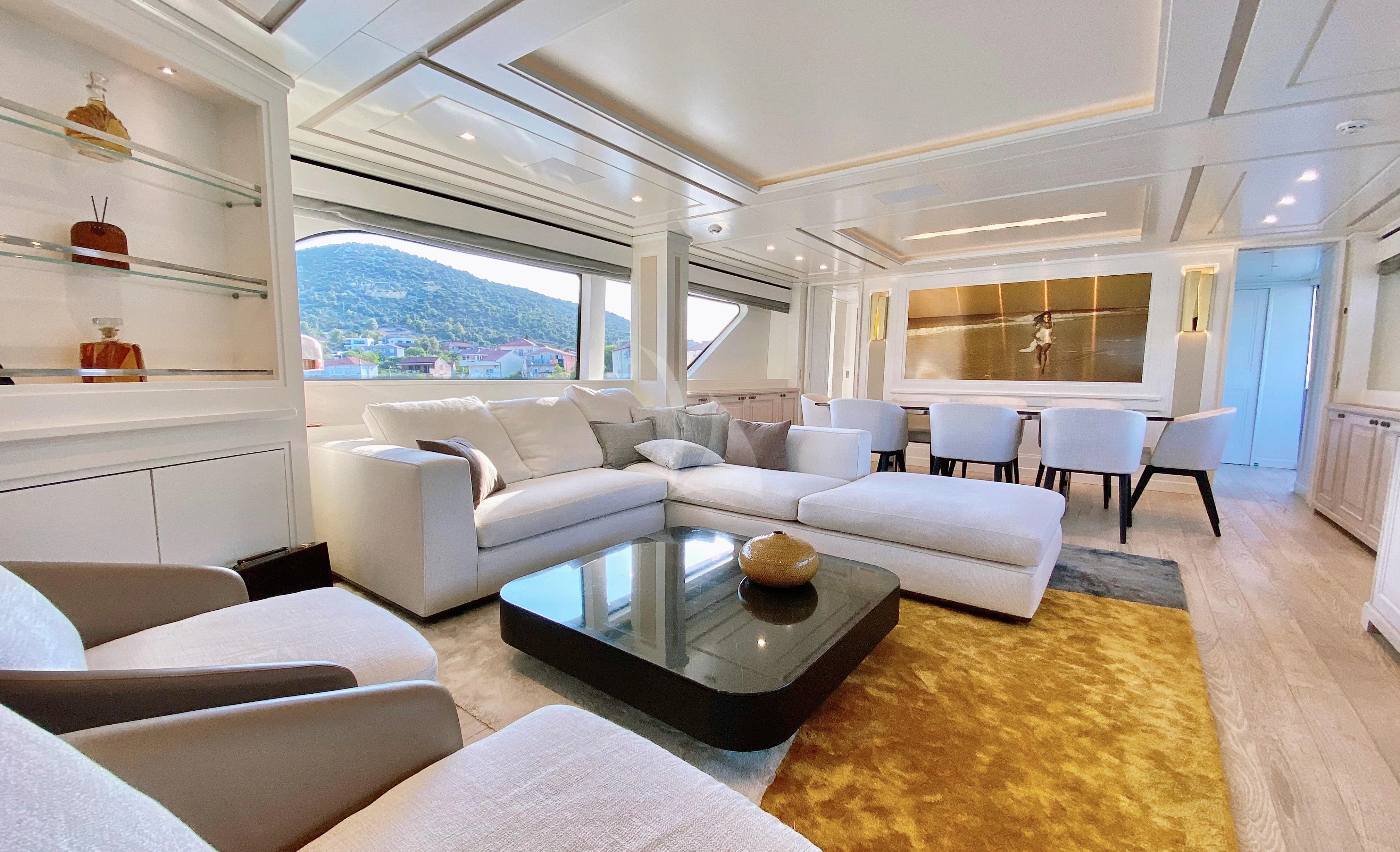 a living room with a large window aboard VALENTINA II Yacht for Sale