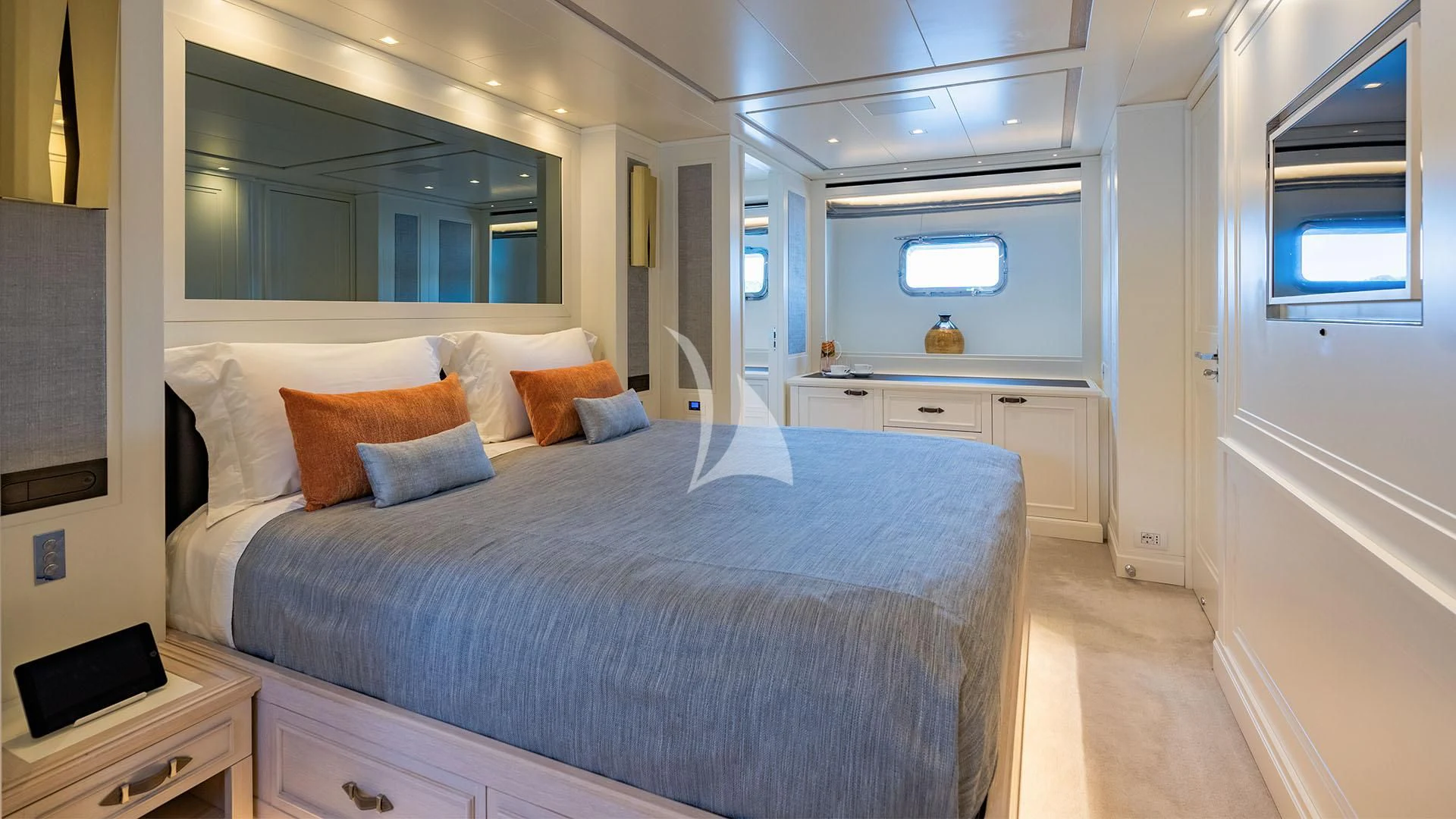 a bedroom with a bed and a desk aboard VALENTINA II Yacht for Sale
