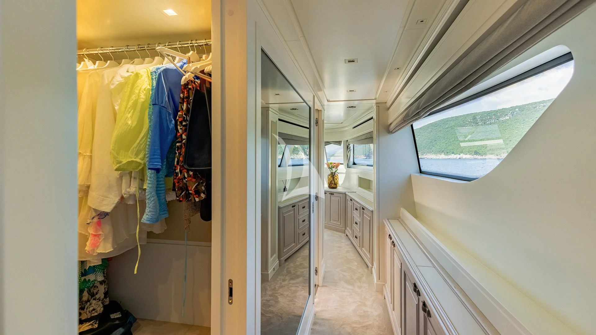 a room with clothes on the swinger aboard VALENTINA II Yacht for Sale