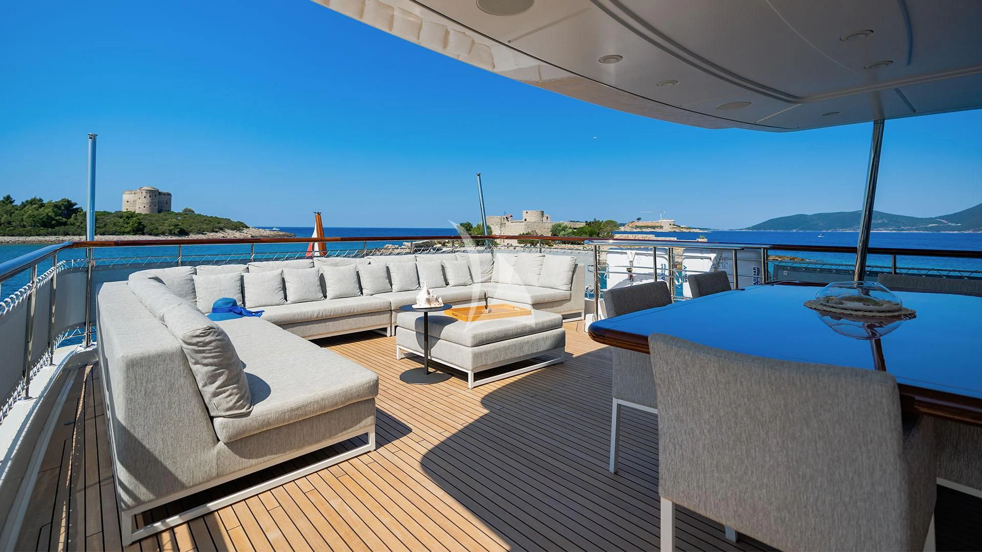 a deck with a large pool aboard VALENTINA II Yacht for Sale