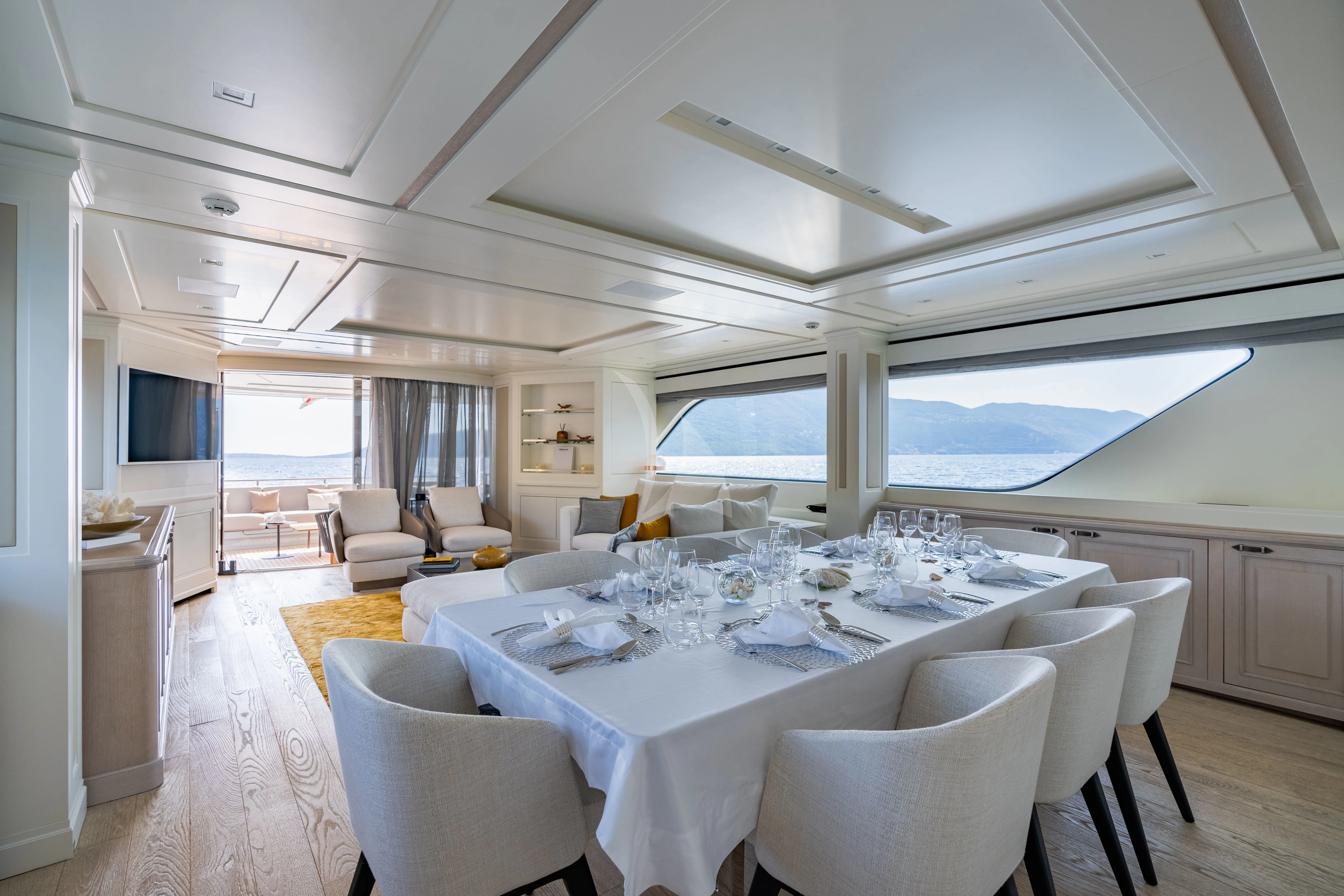 a large white dining table aboard VALENTINA II Yacht for Sale