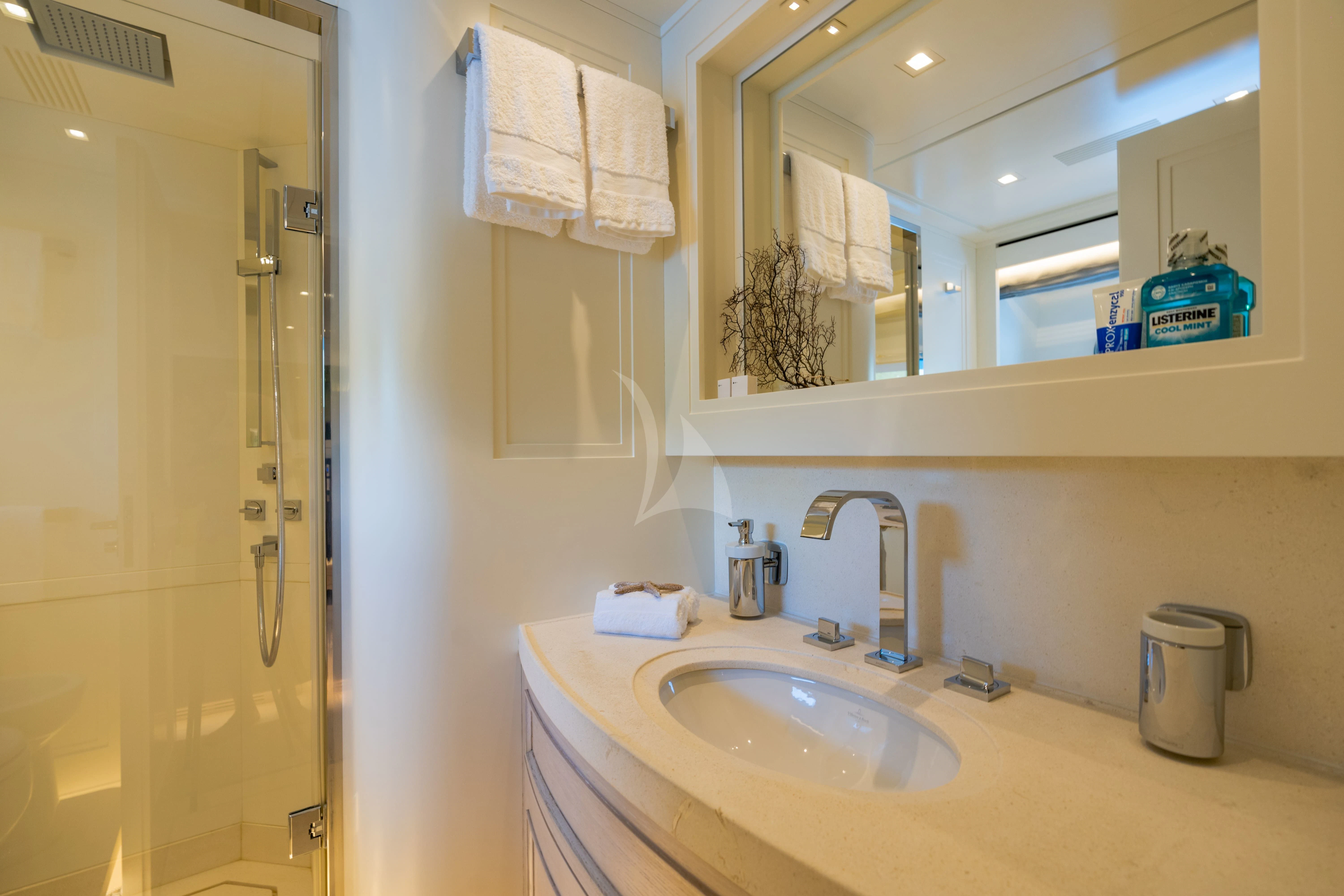 a bathroom with a sink and a mirror aboard VALENTINA II Yacht for Sale