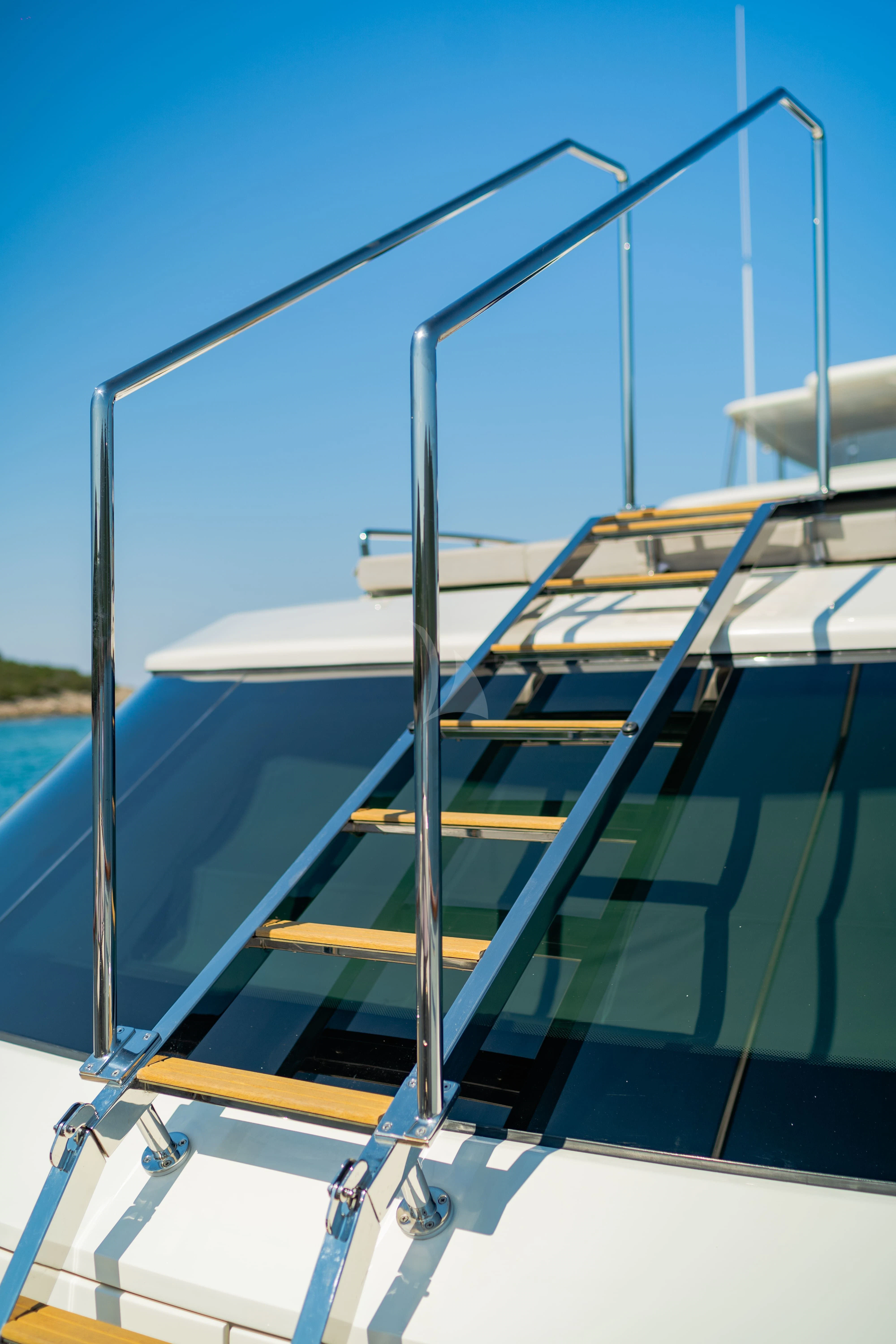 a deck with a railing and a railing with a body of water in the background aboard VALENTINA II Yacht for Sale