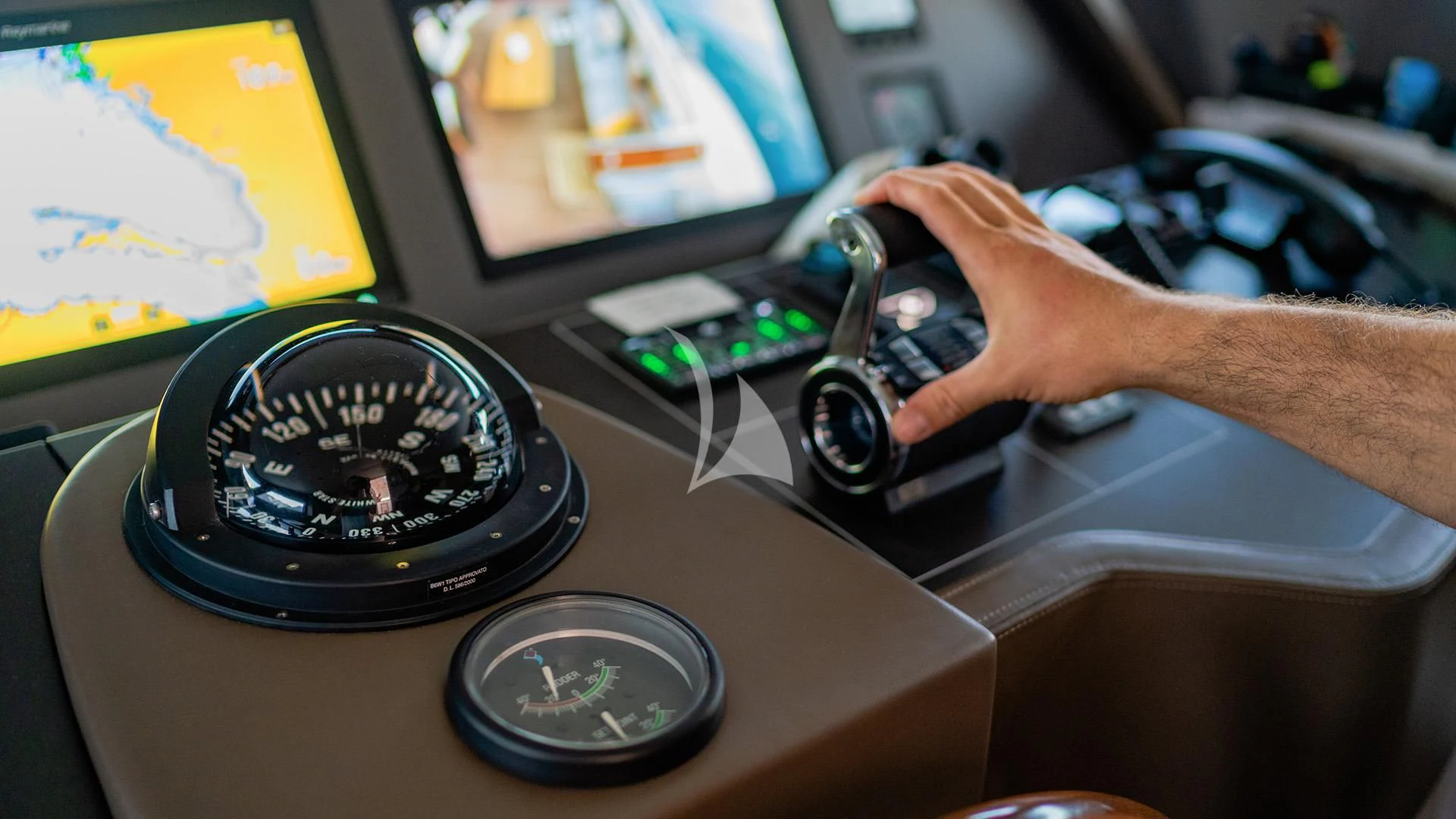 a person holding a black and silver camera aboard VALENTINA II Yacht for Sale