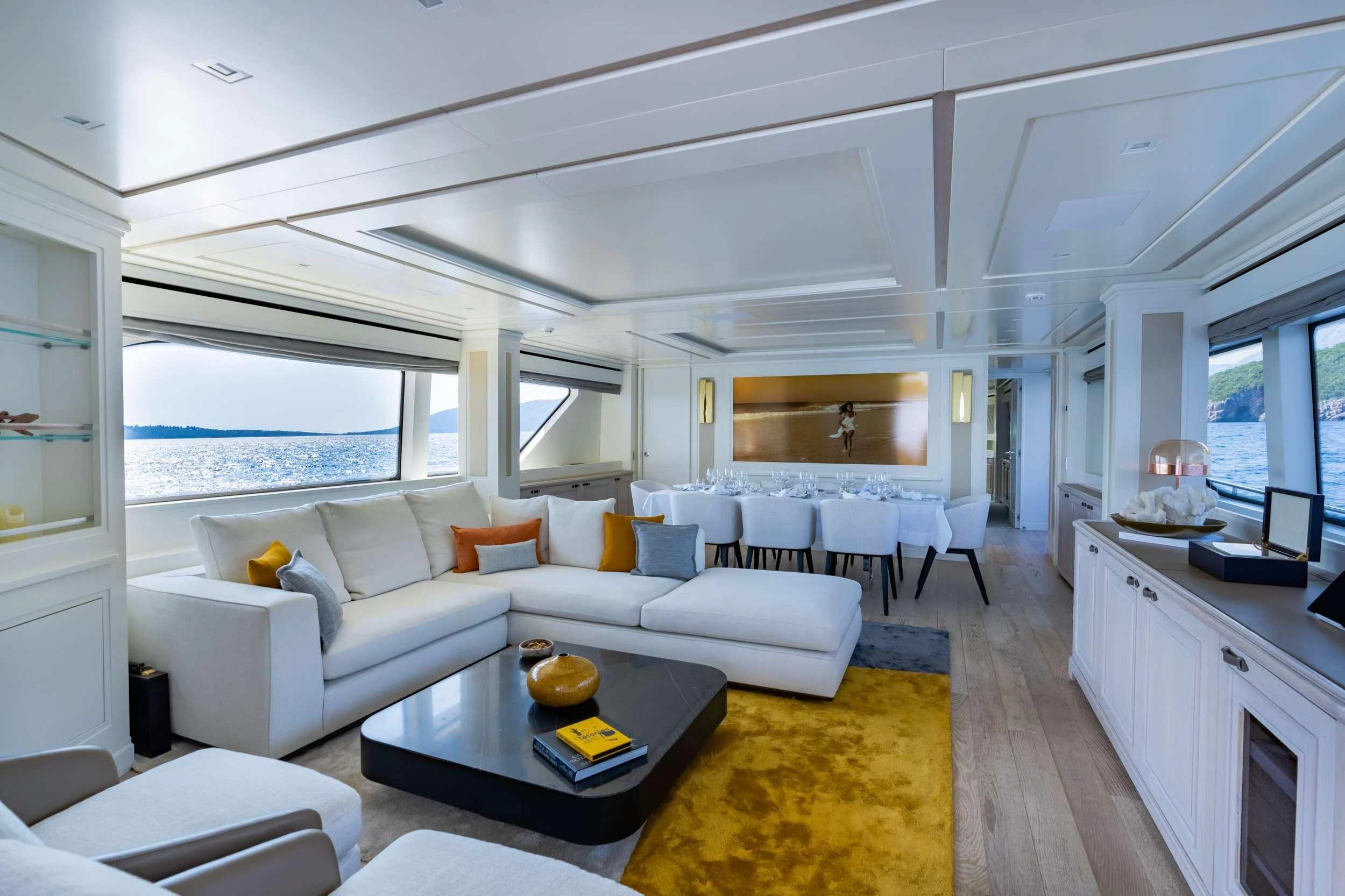 a living room with a large window aboard VALENTINA II Yacht for Sale