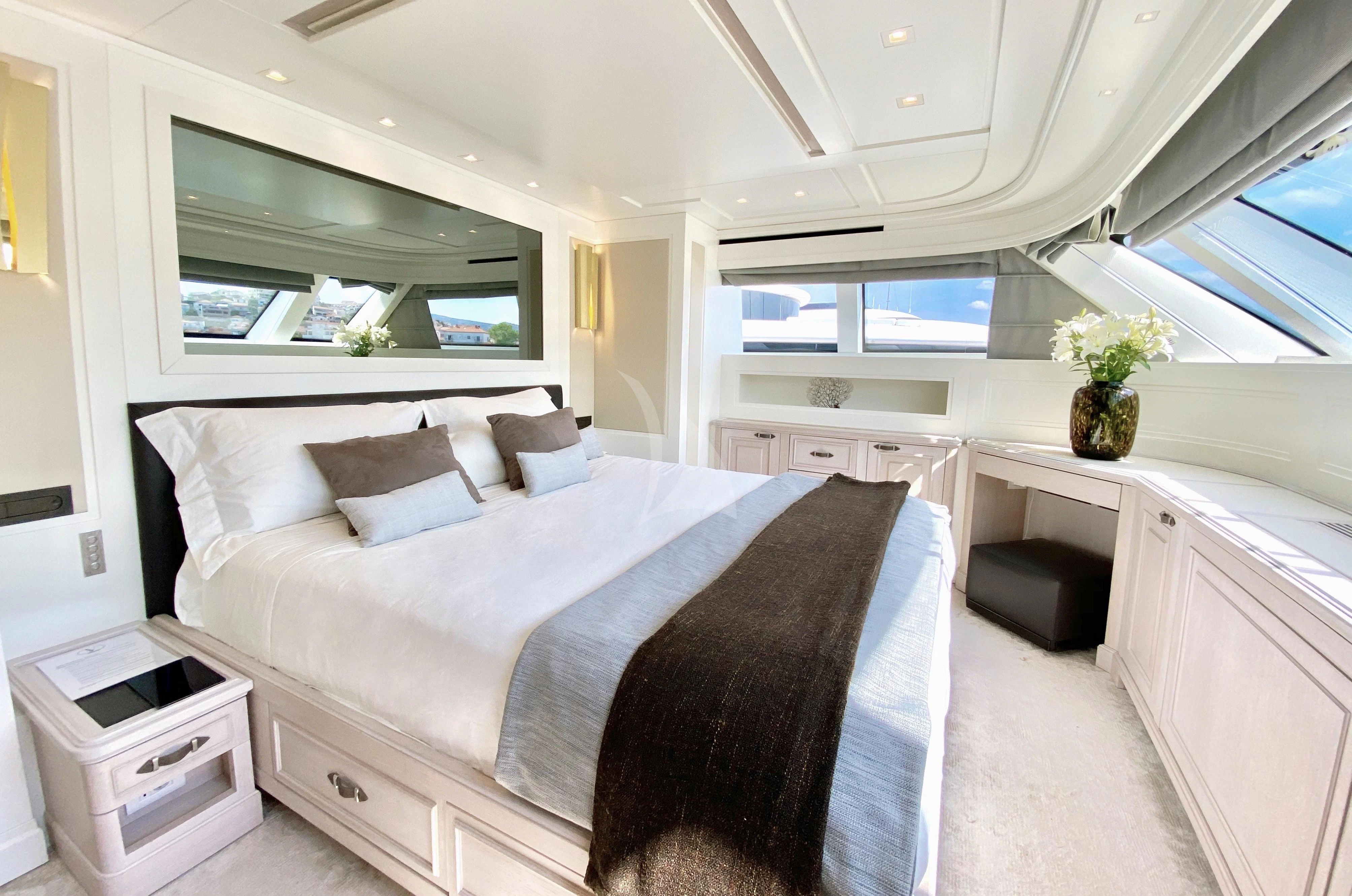 a large bedroom with a large bed aboard VALENTINA II Yacht for Sale