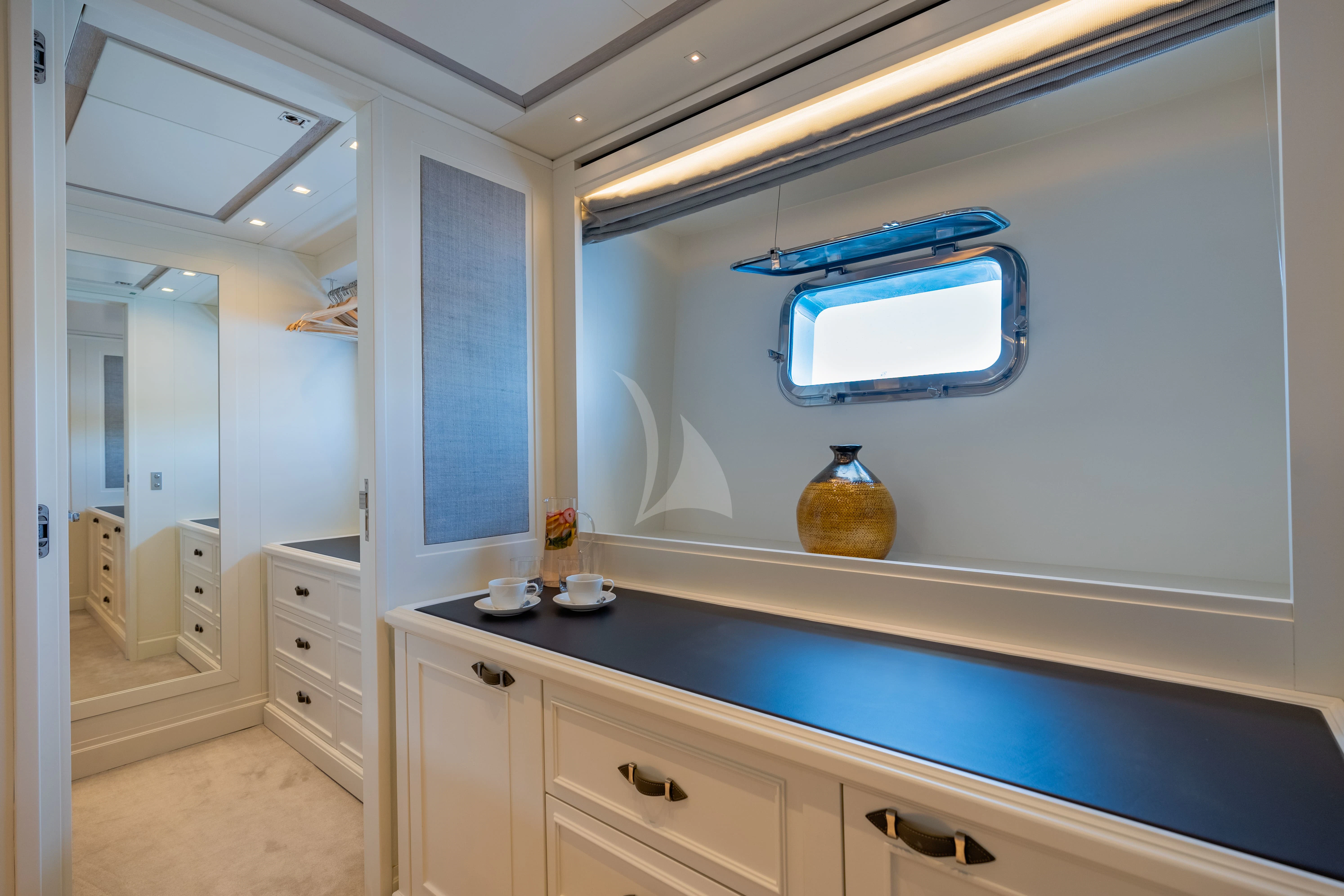 a room with cabinets and a window aboard VALENTINA II Yacht for Sale