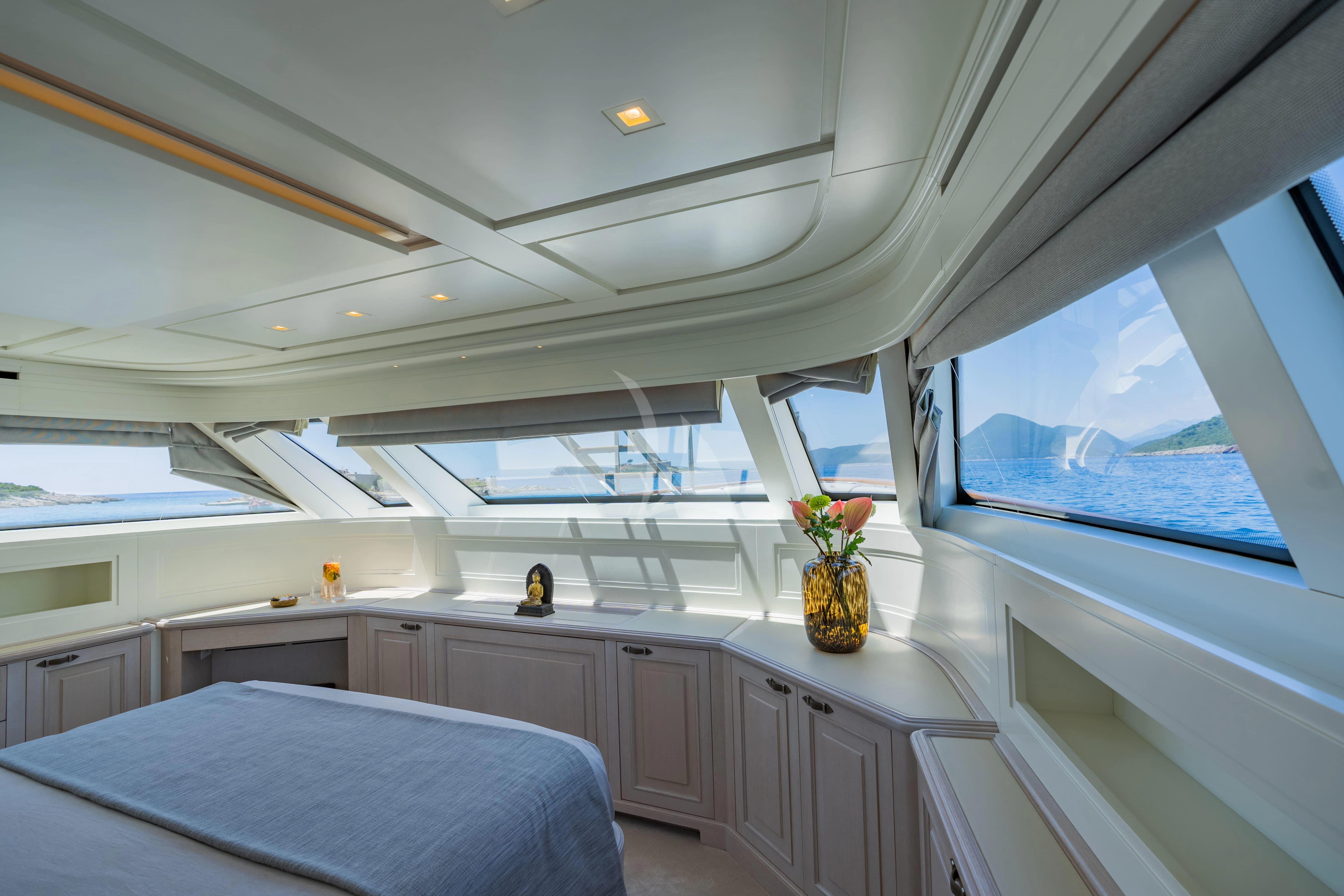 a room with a bed and a window aboard VALENTINA II Yacht for Sale