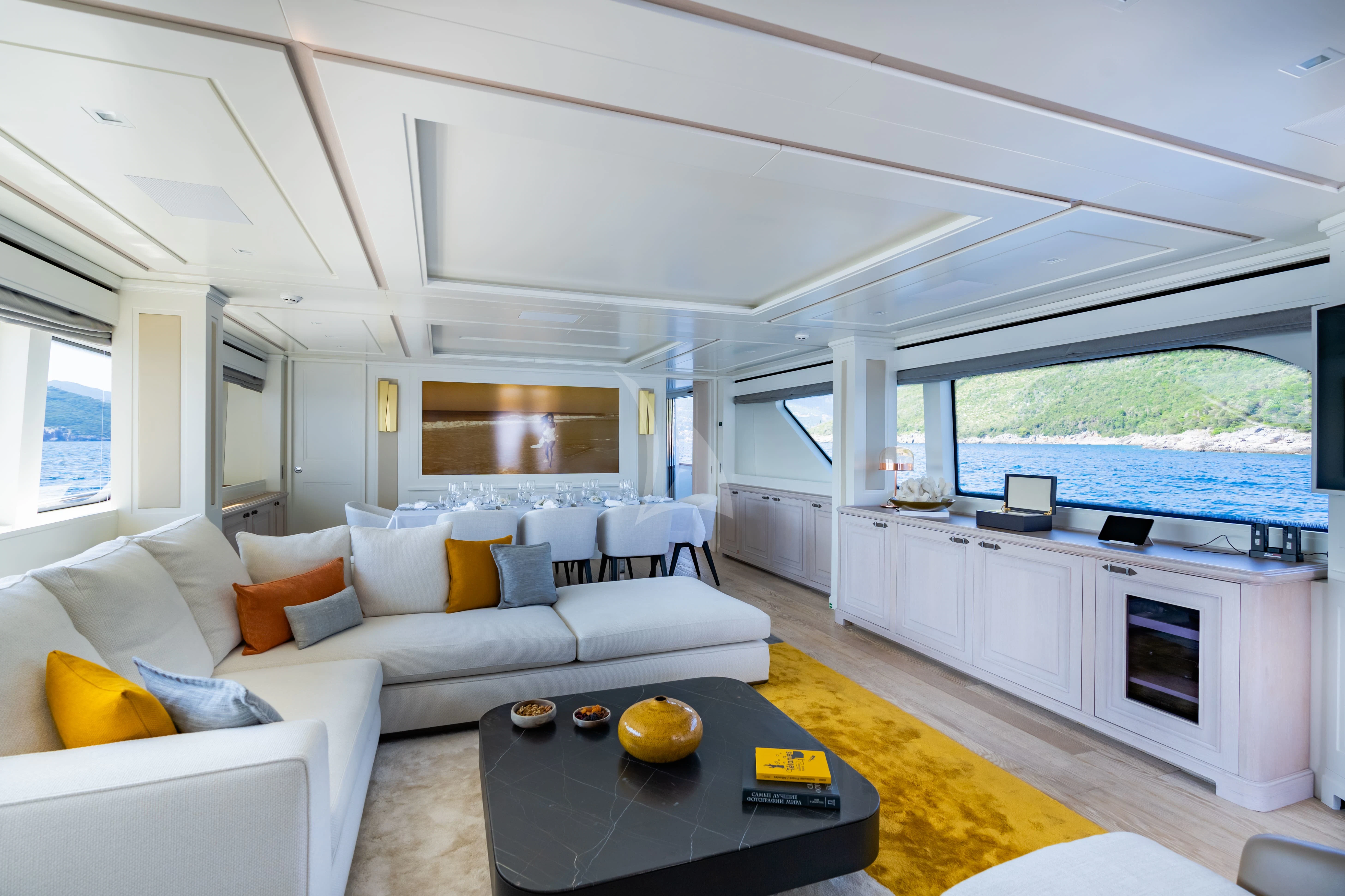 a living room with a large window aboard VALENTINA II Yacht for Sale