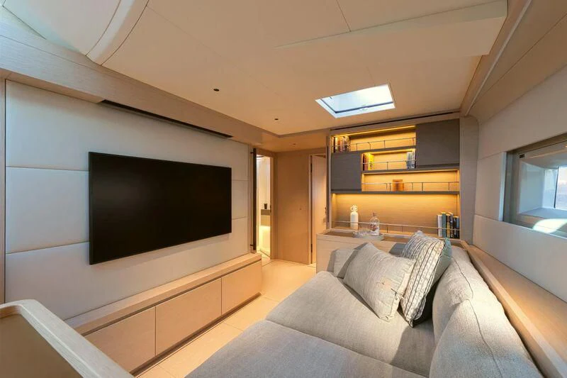 a living room with a large tv aboard LIBERTY SQUARED Yacht for Sale