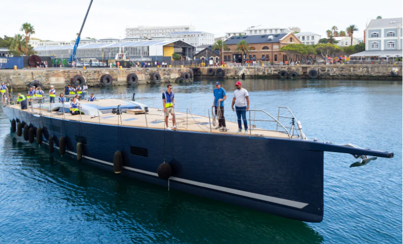 a group of people on a dock aboard LIBERTY SQUARED Yacht for Sale