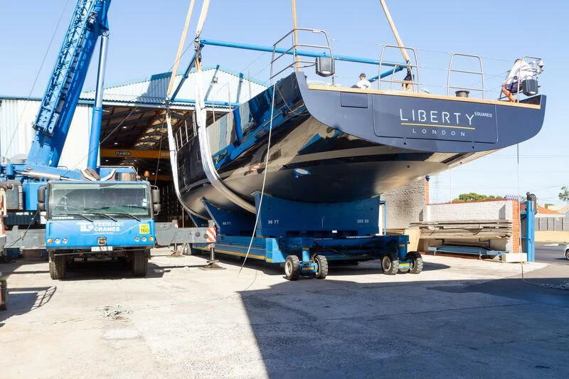a large boat docked at a port aboard LIBERTY SQUARED Yacht for Sale