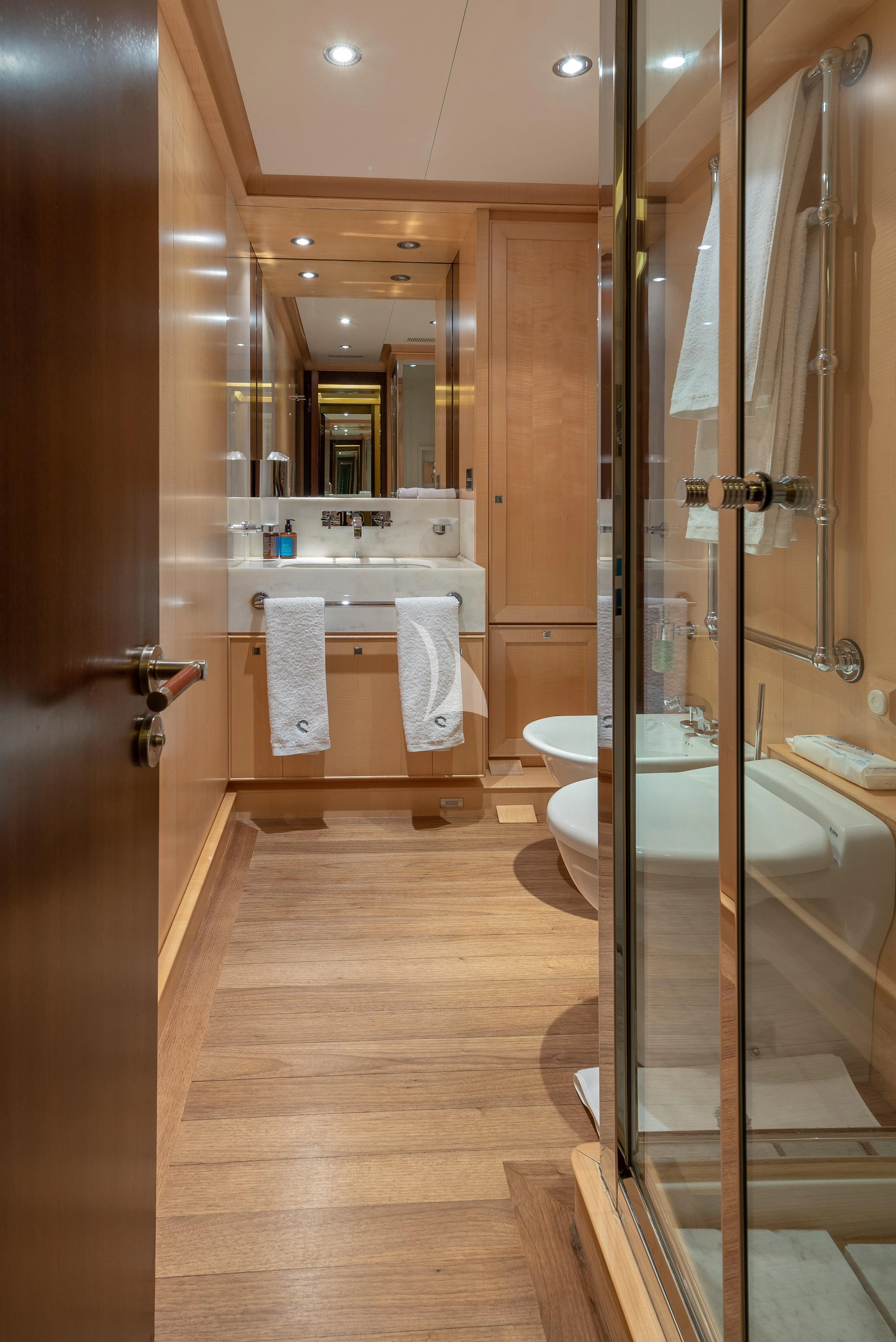 a bathroom with a glass shower aboard VICTORIA A Yacht for Charter