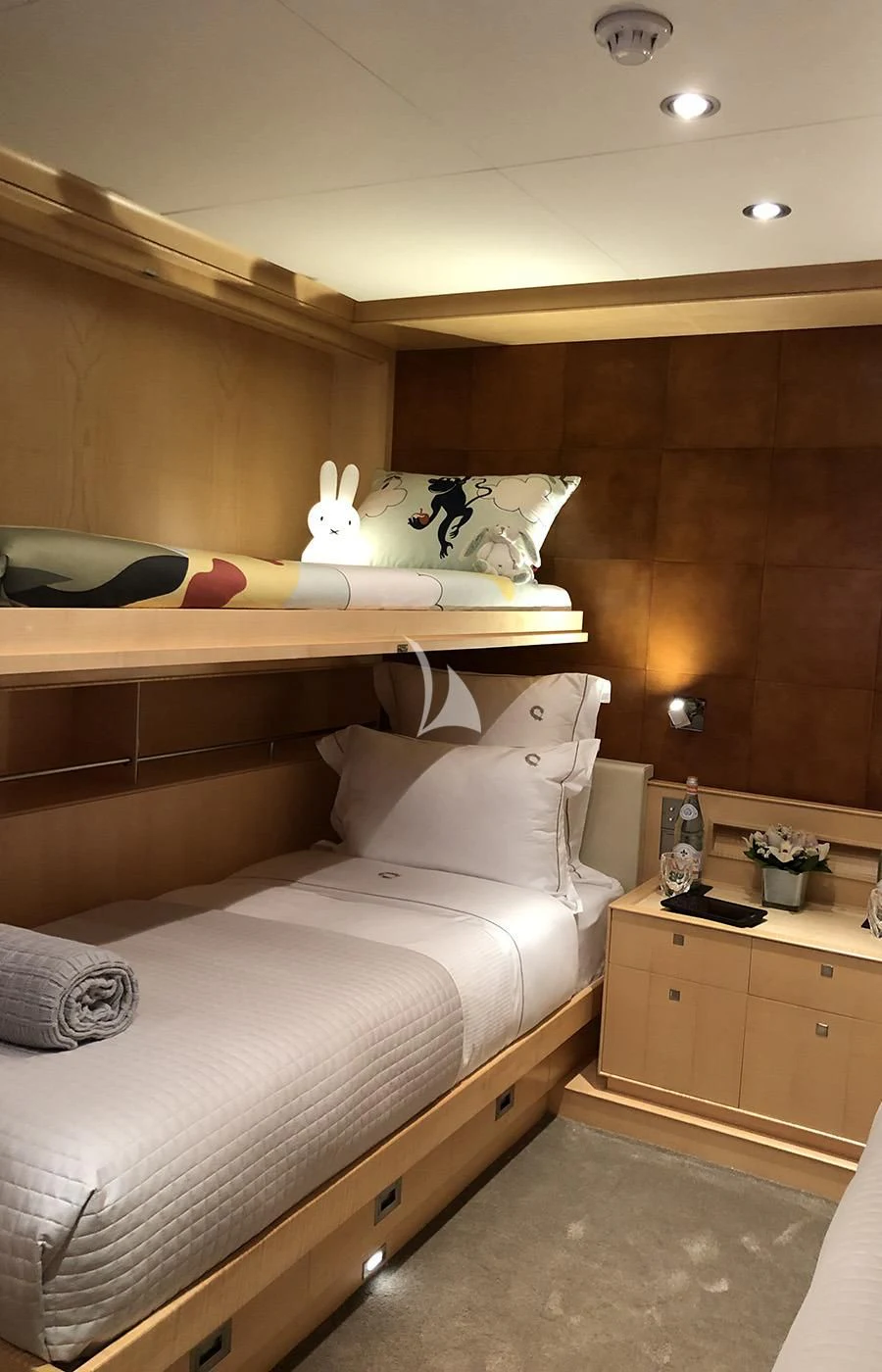 a bed with white sheets aboard VICTORIA A Yacht for Charter