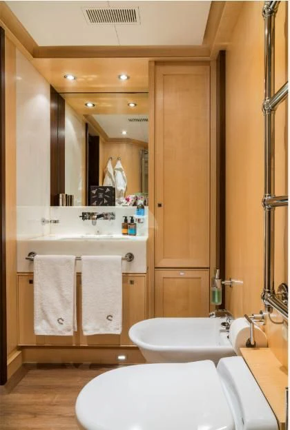 a bathroom with a large mirror aboard VICTORIA A Yacht for Charter
