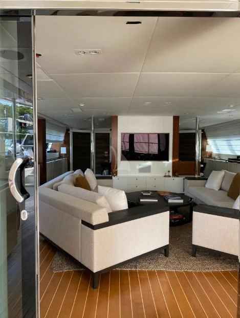 a living room with a large mirror aboard VICTORIA A Yacht for Charter
