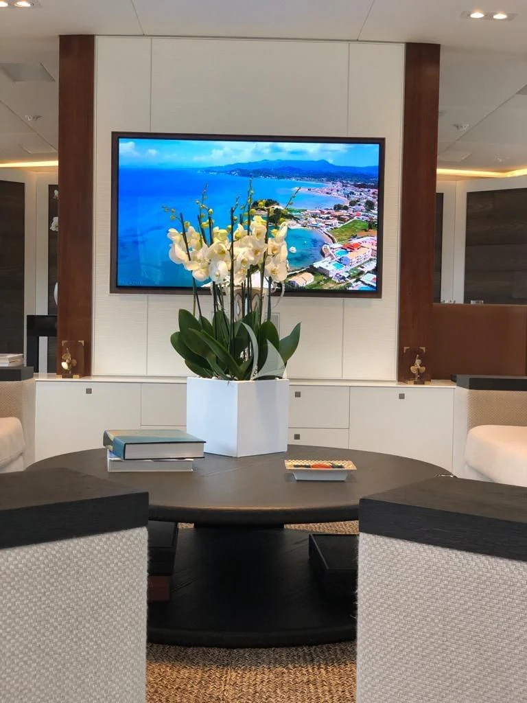 a tv on a wall aboard VICTORIA A Yacht for Charter