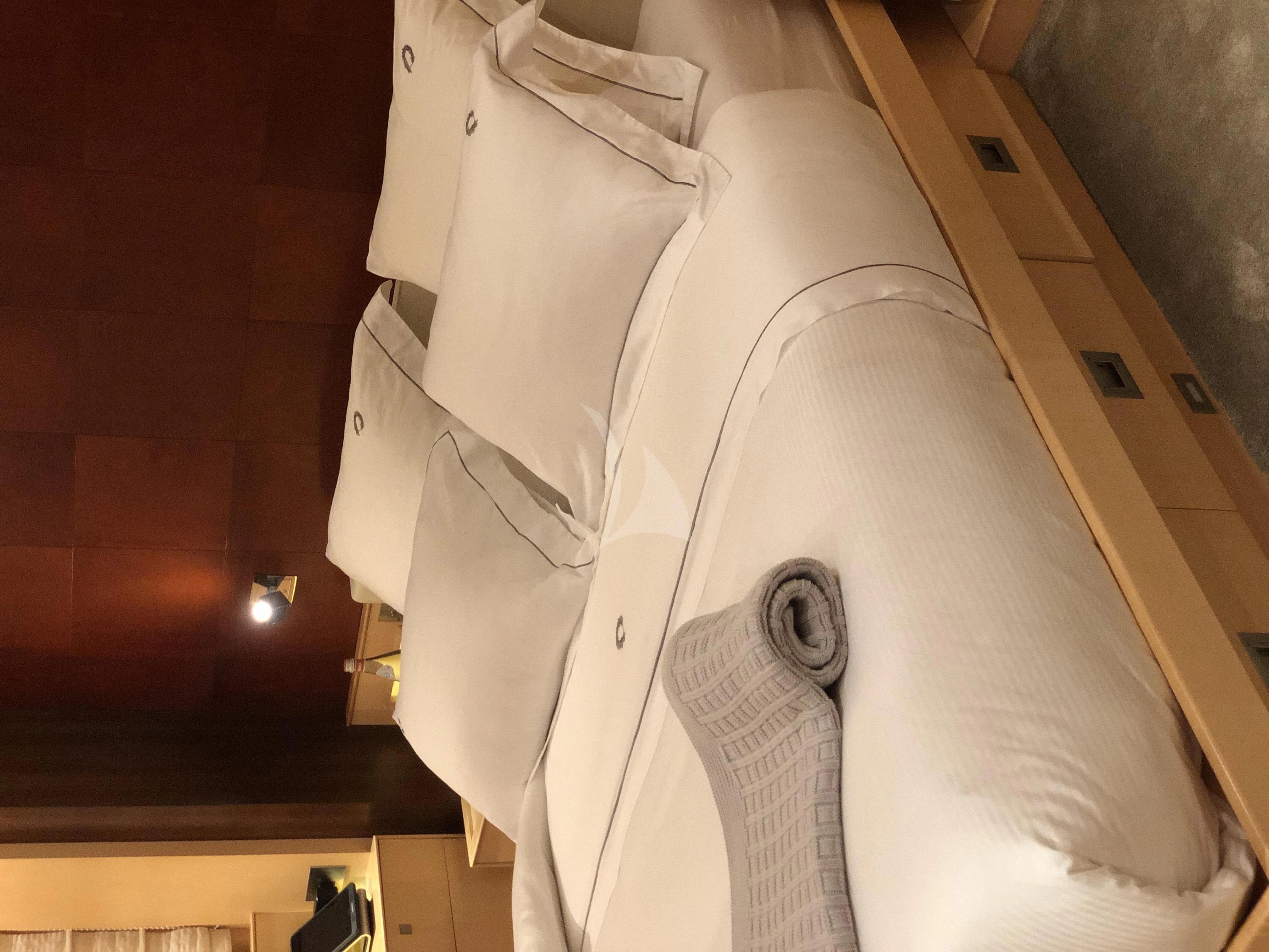 a mannequin wearing a white suit and tie aboard VICTORIA A Yacht for Charter