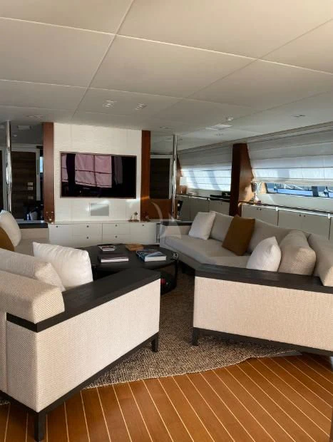 a living room with a couch and a tv aboard VICTORIA A Yacht for Charter