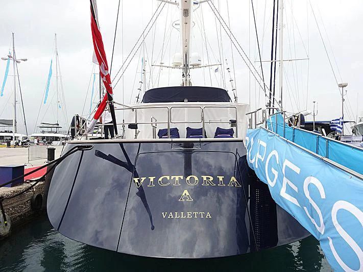 a boat docked at a pier aboard VICTORIA A Yacht for Charter