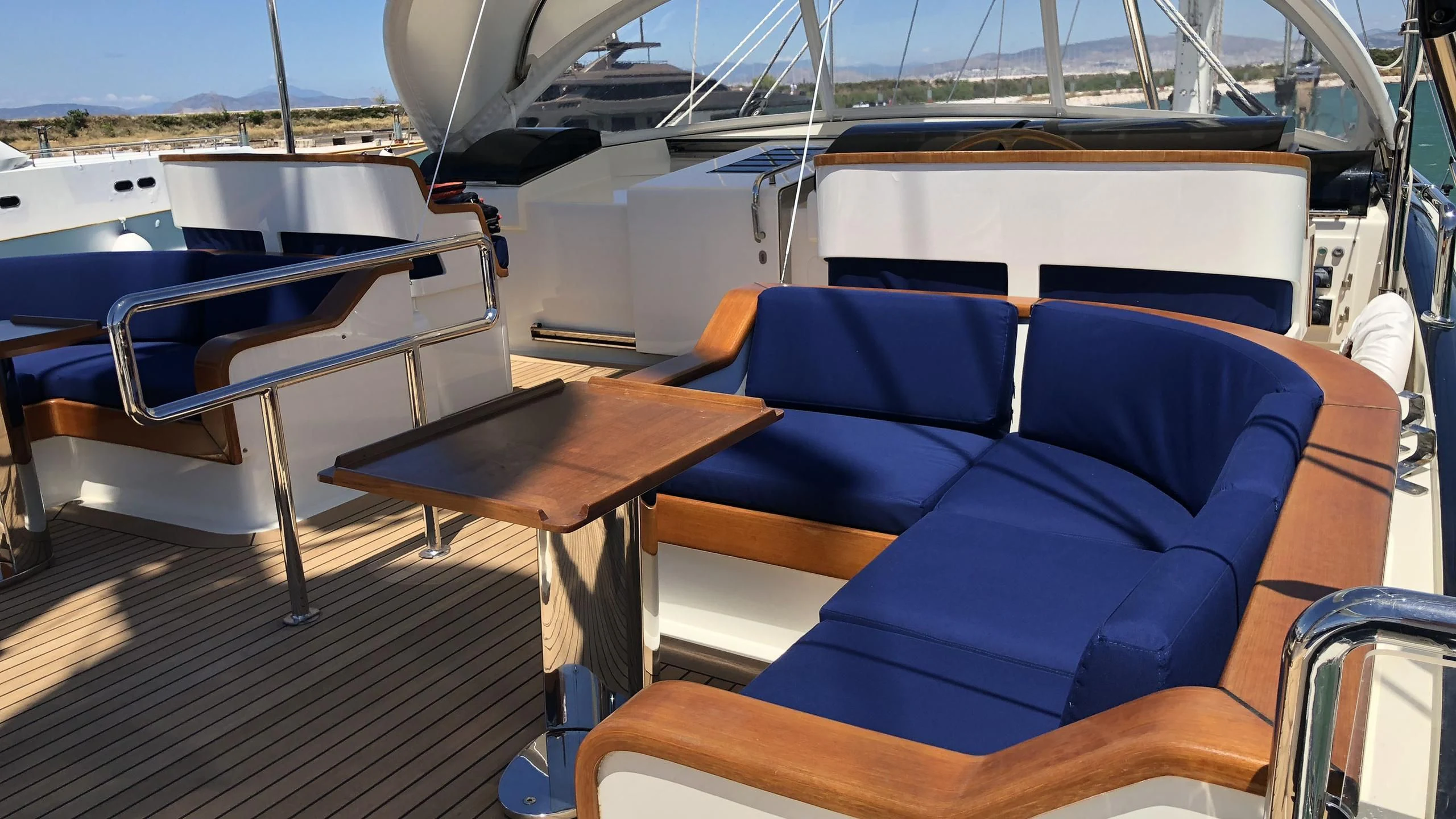a boat with a table and chairs aboard VICTORIA A Yacht for Charter