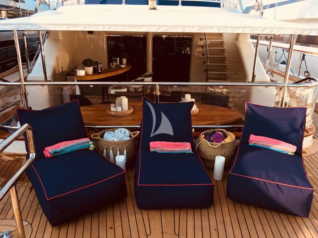 a couple of chairs on a deck aboard VICTORIA A Yacht for Charter