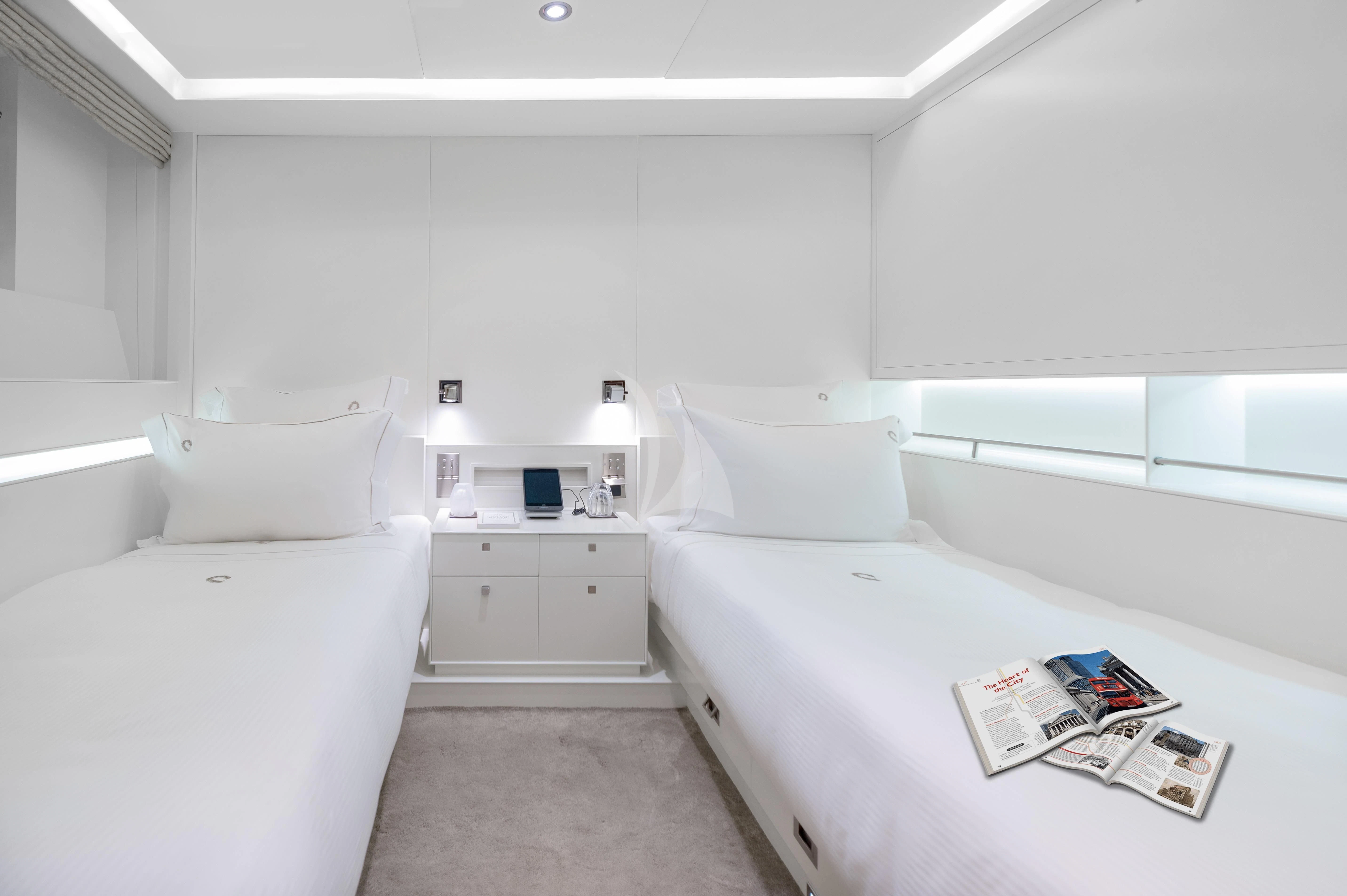 a room with a bed and a desk aboard VICTORIA A Yacht for Charter