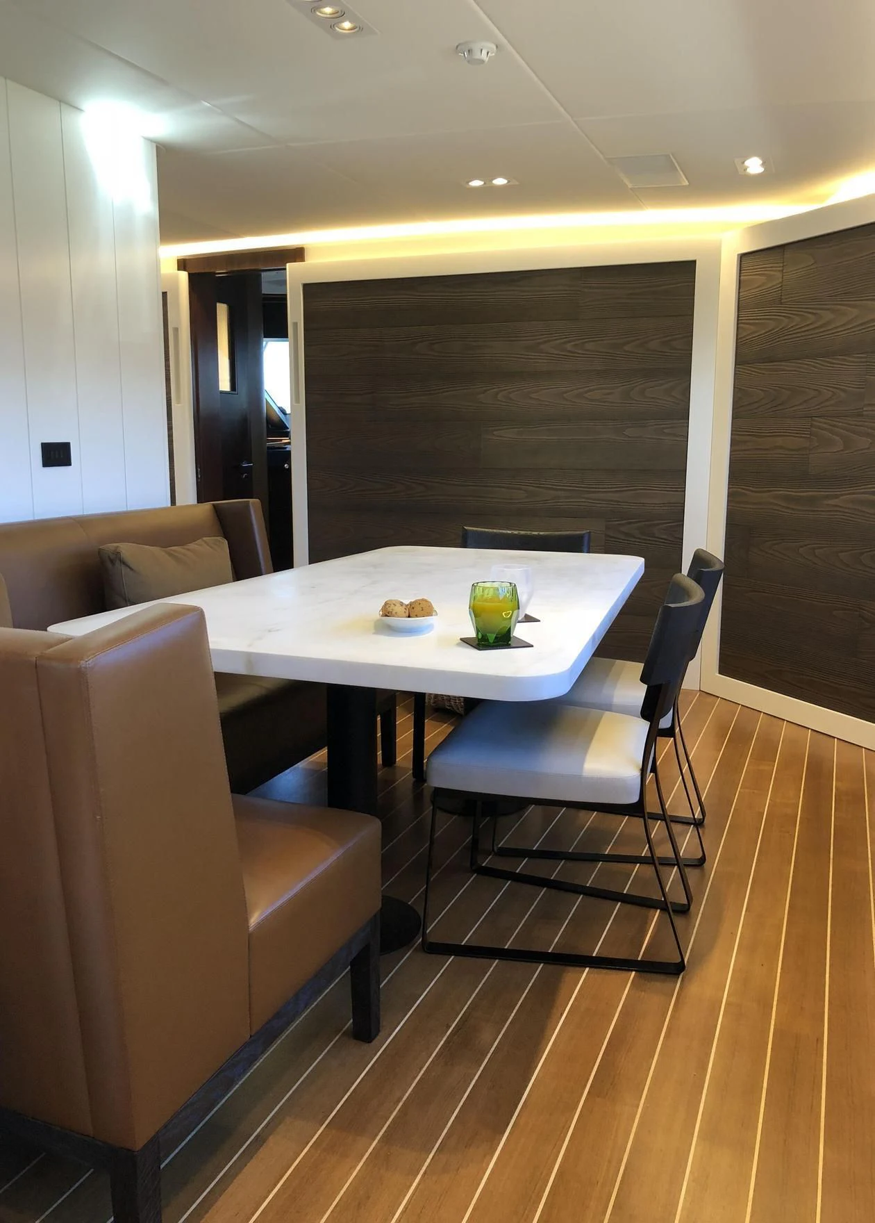 a table and chairs in a room aboard VICTORIA A Yacht for Charter