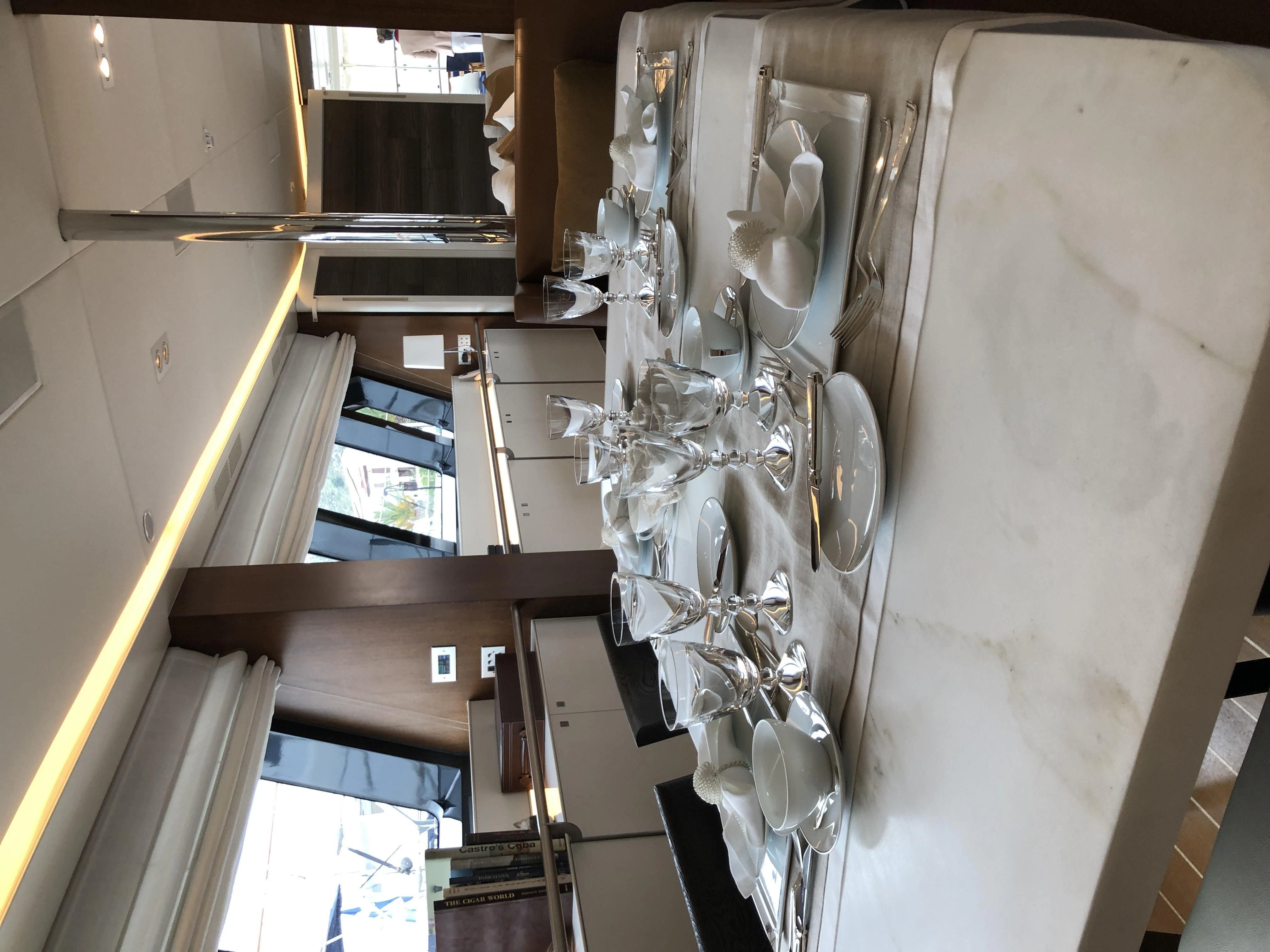 a room with a chandelier aboard VICTORIA A Yacht for Charter